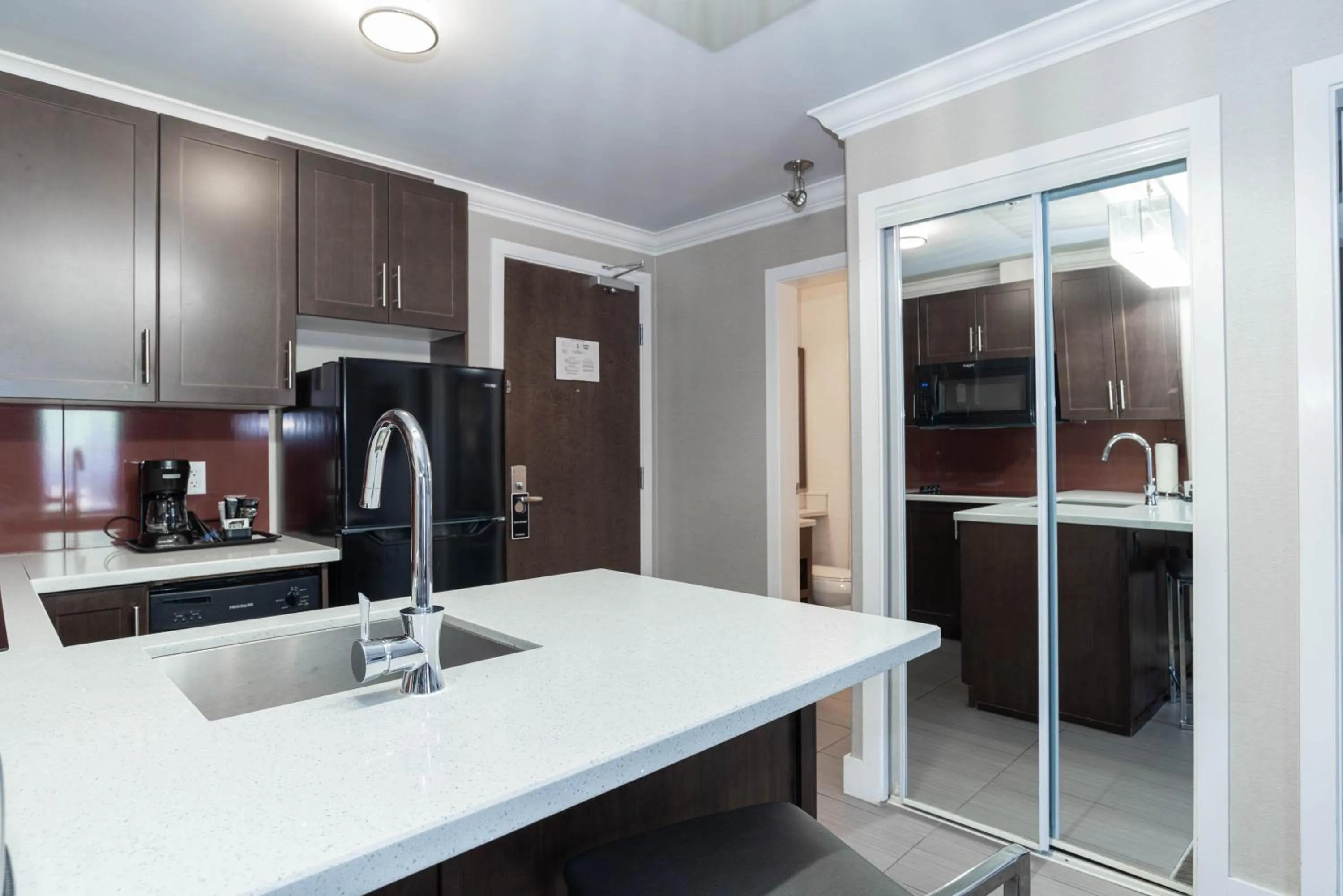 Kitchen or kitchenette in Sandman Hotel & Suites Calgary South