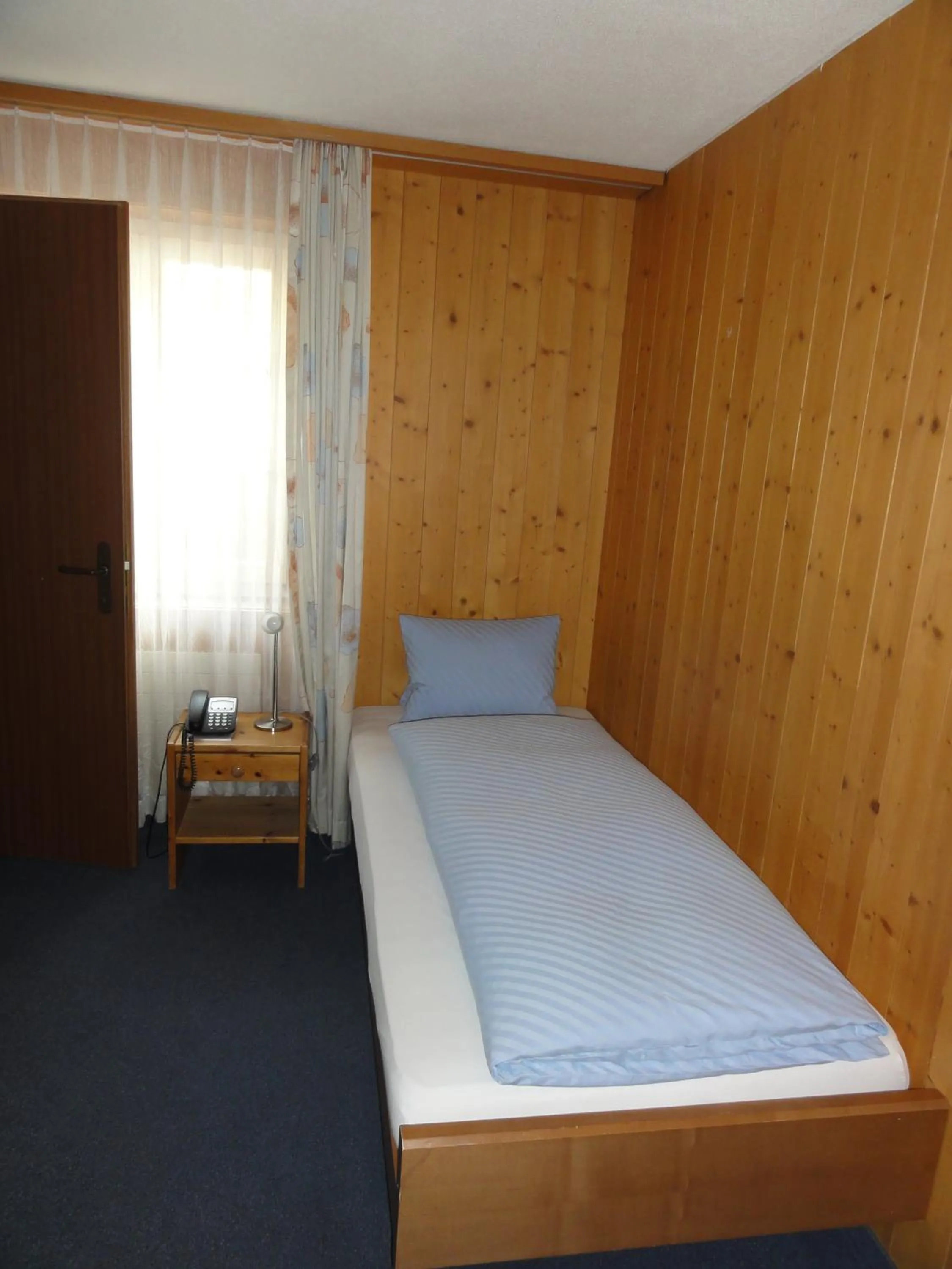 Bed in Hotel Steinbock Grindelwald