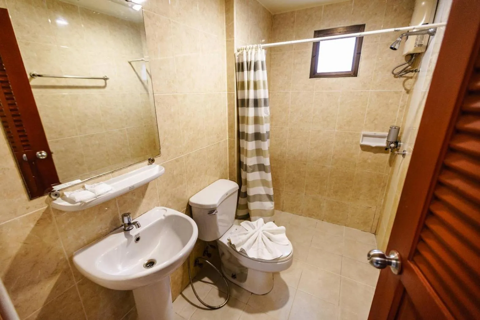 Bathroom in New Travel Beach Hotel & Resort