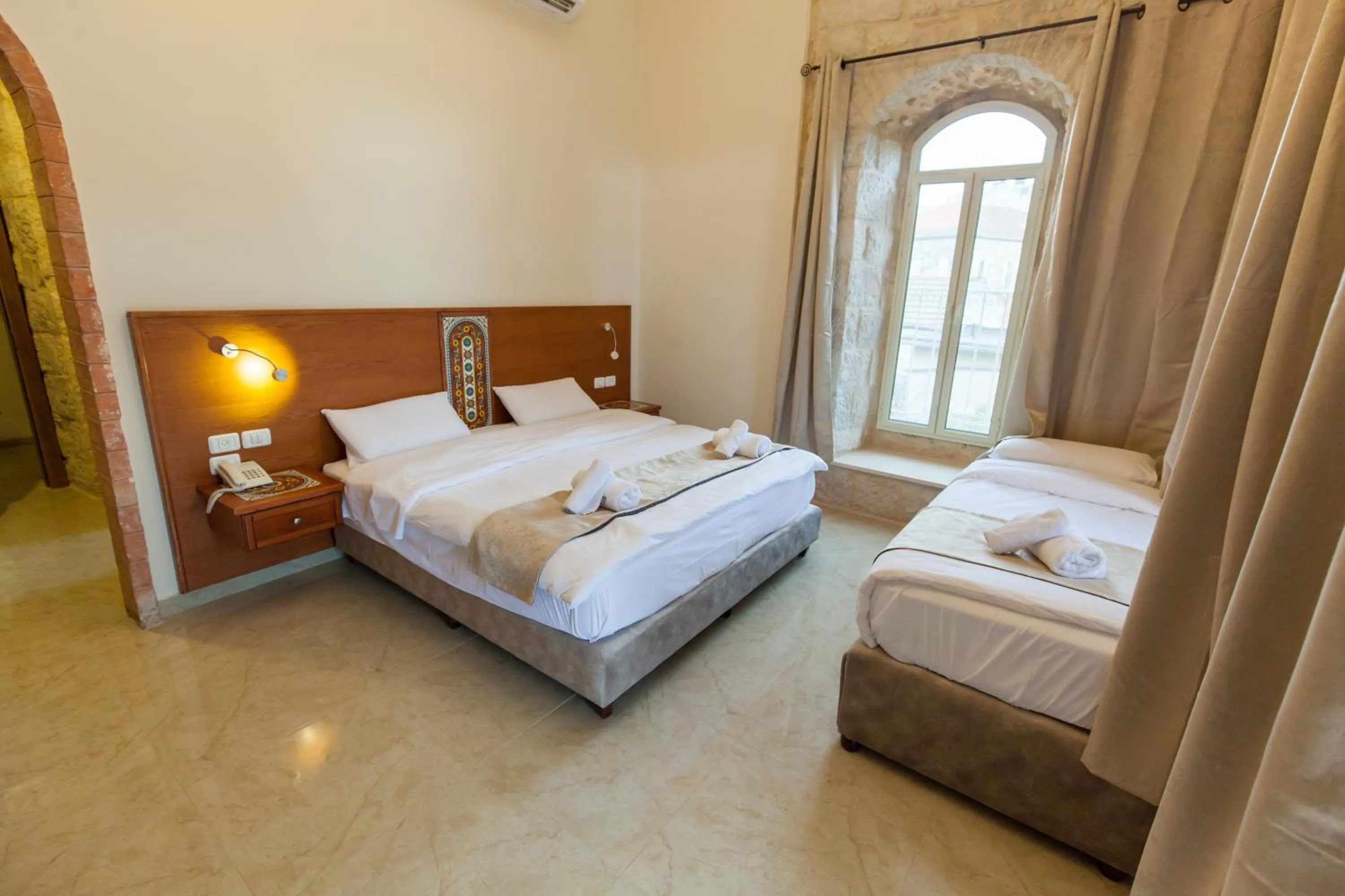 Photo of the whole room, Bed in Azzahra Boutique Hotel & Restaurant - Jerusalem