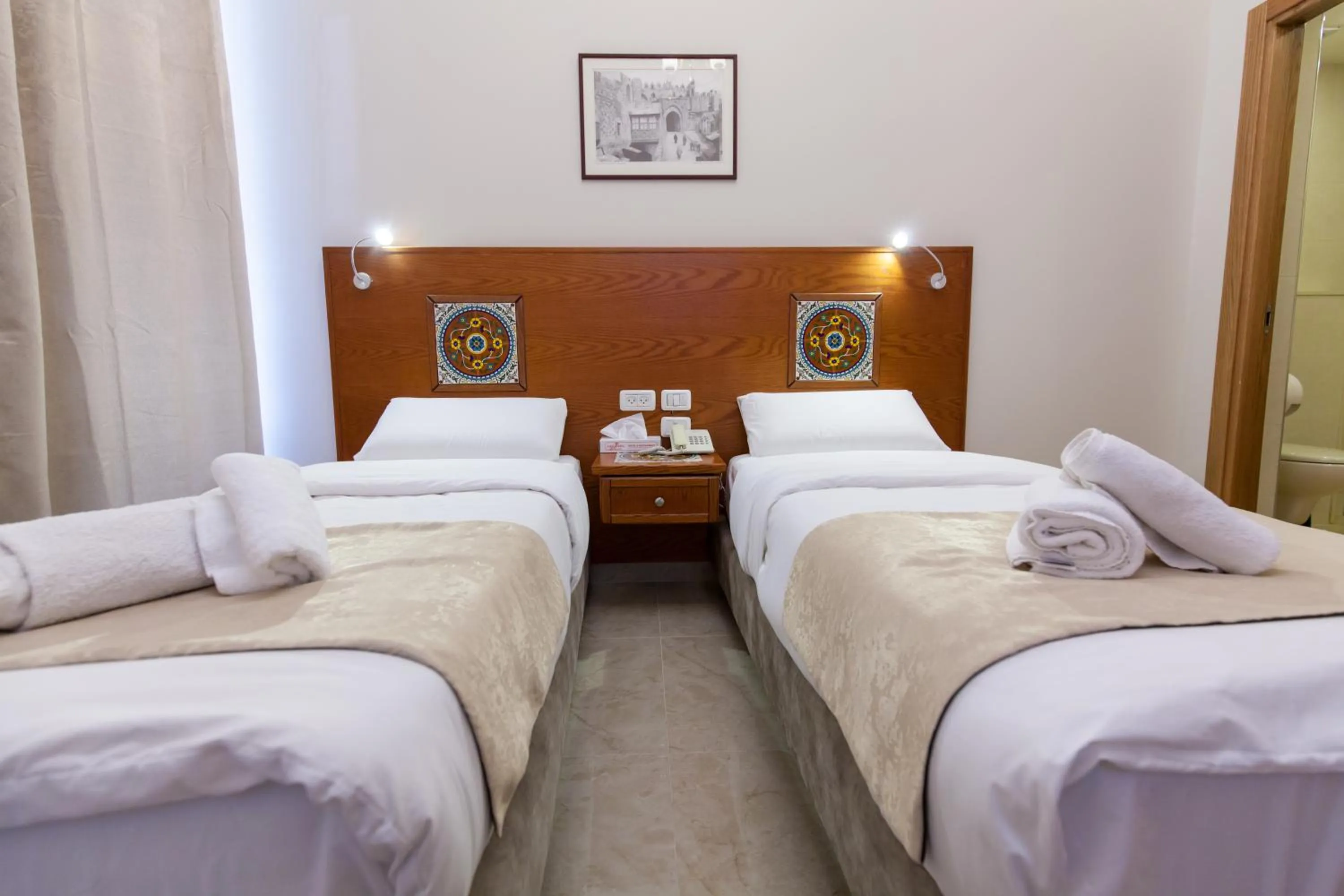 Photo of the whole room, Bed in Azzahra Boutique Hotel & Restaurant - Jerusalem