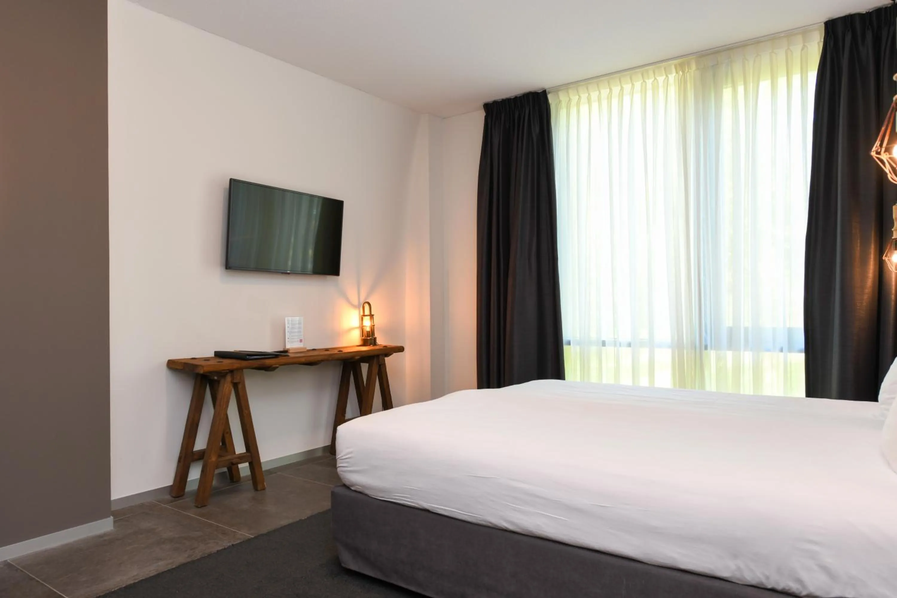 Bed in Hotel De Roode Schuur