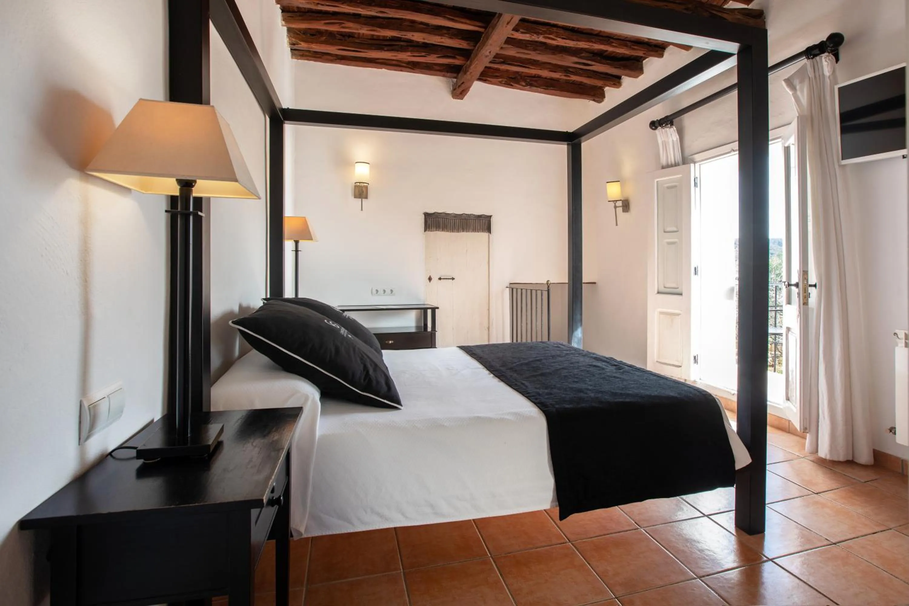 Bed in Agroturismo Can Guillem