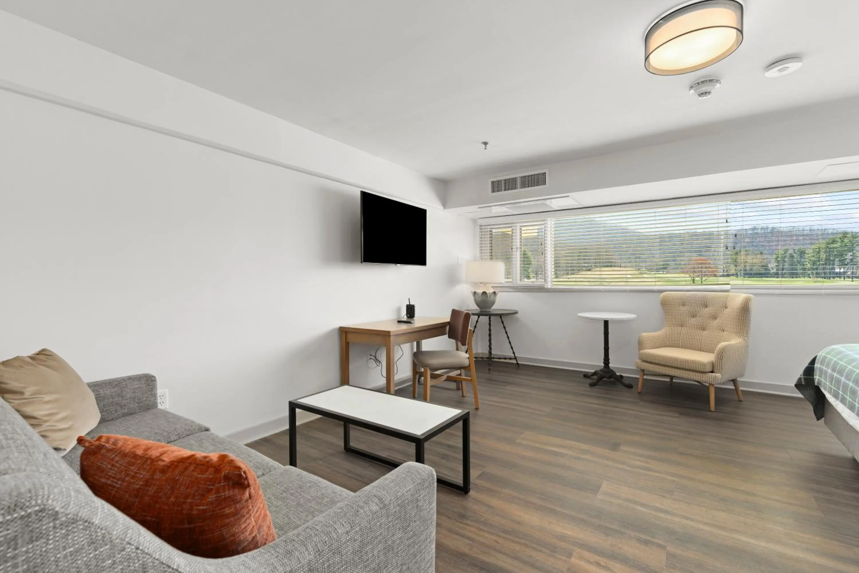 Seating area in Waynesville Inn and Golf Club, Tapestry Collection by Hilton