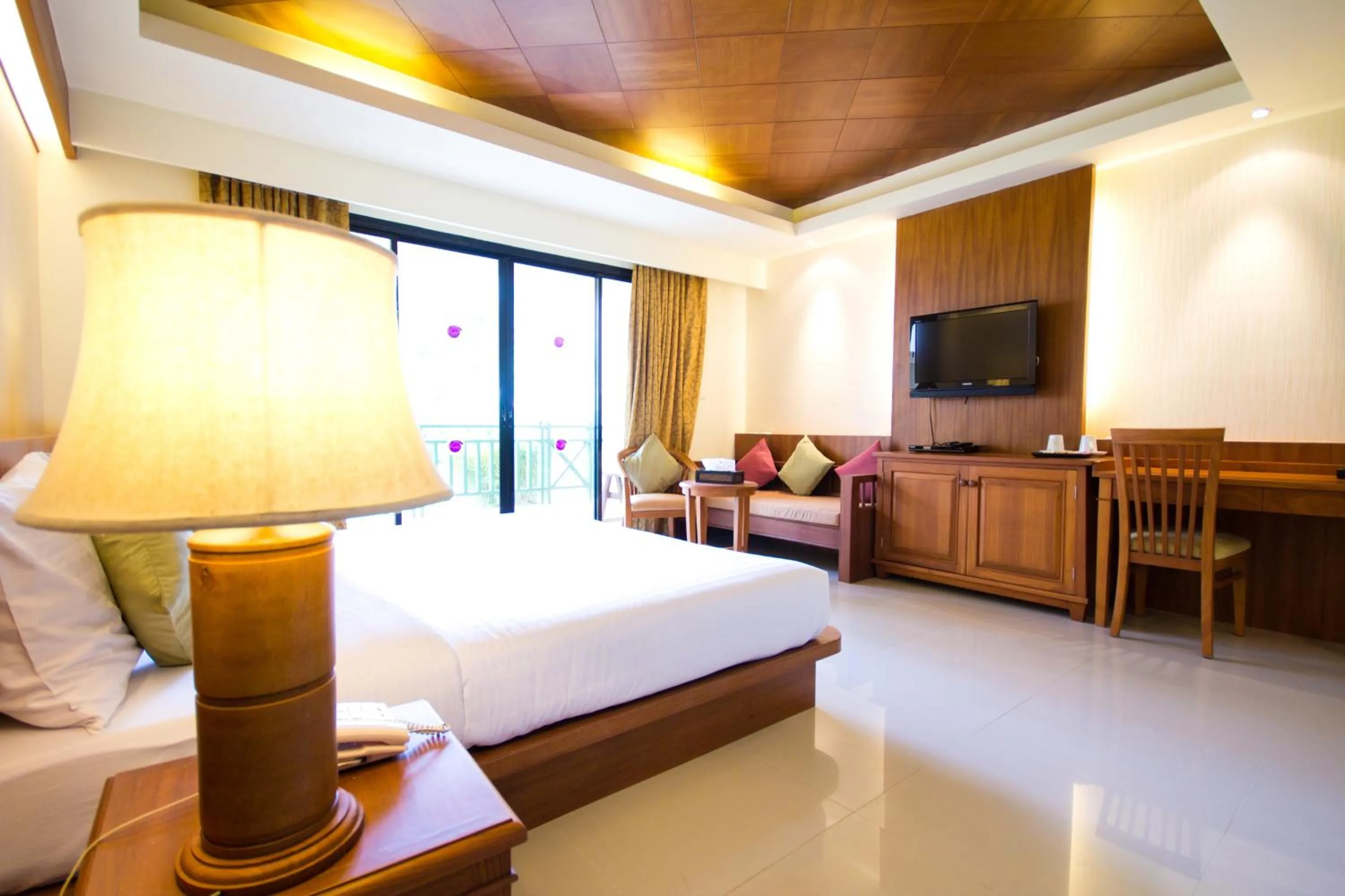Bed in Khaolak Orchid Beach Resort - SHA Extra Plus