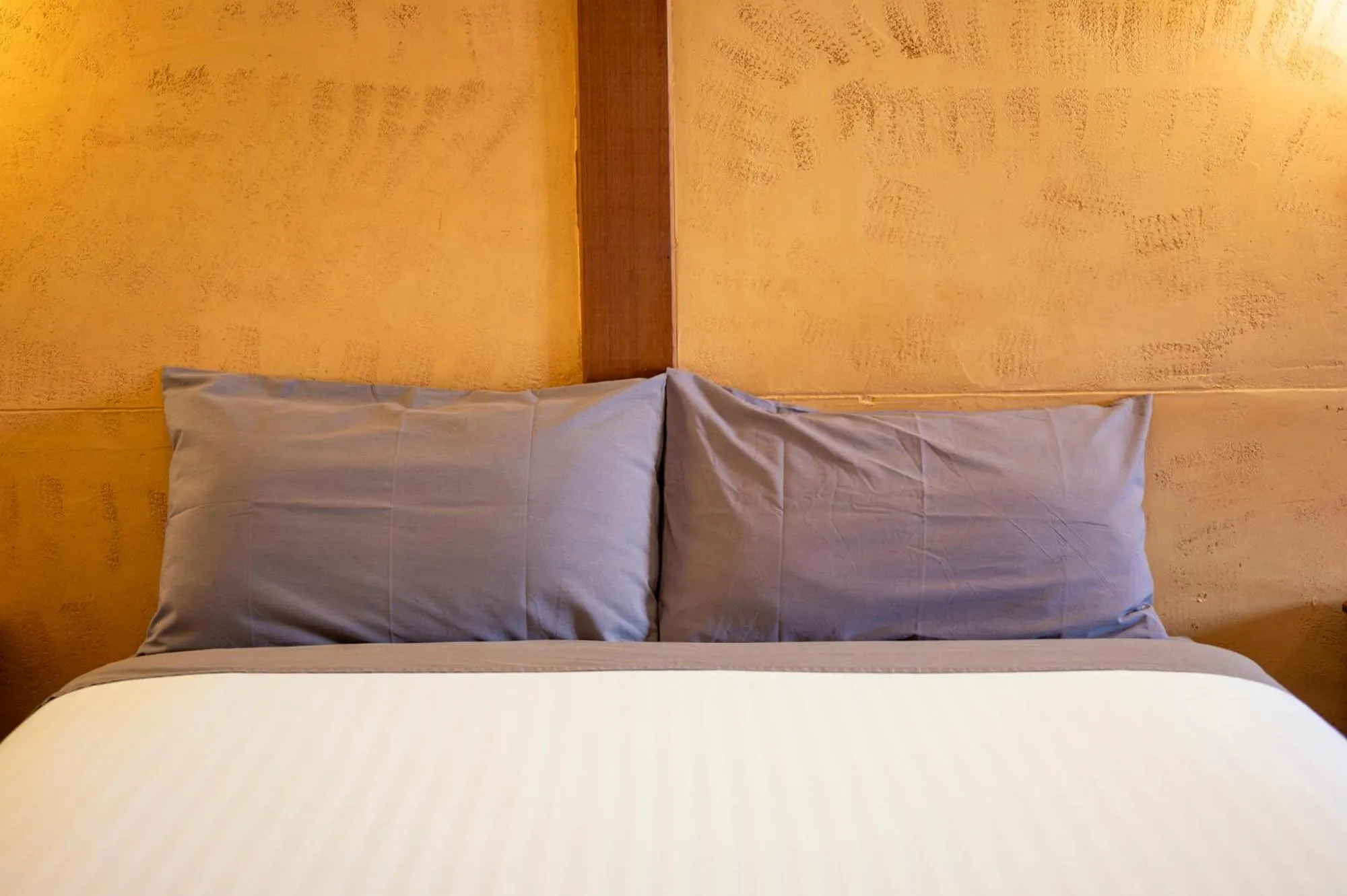 Bed in Mud Hut Motel