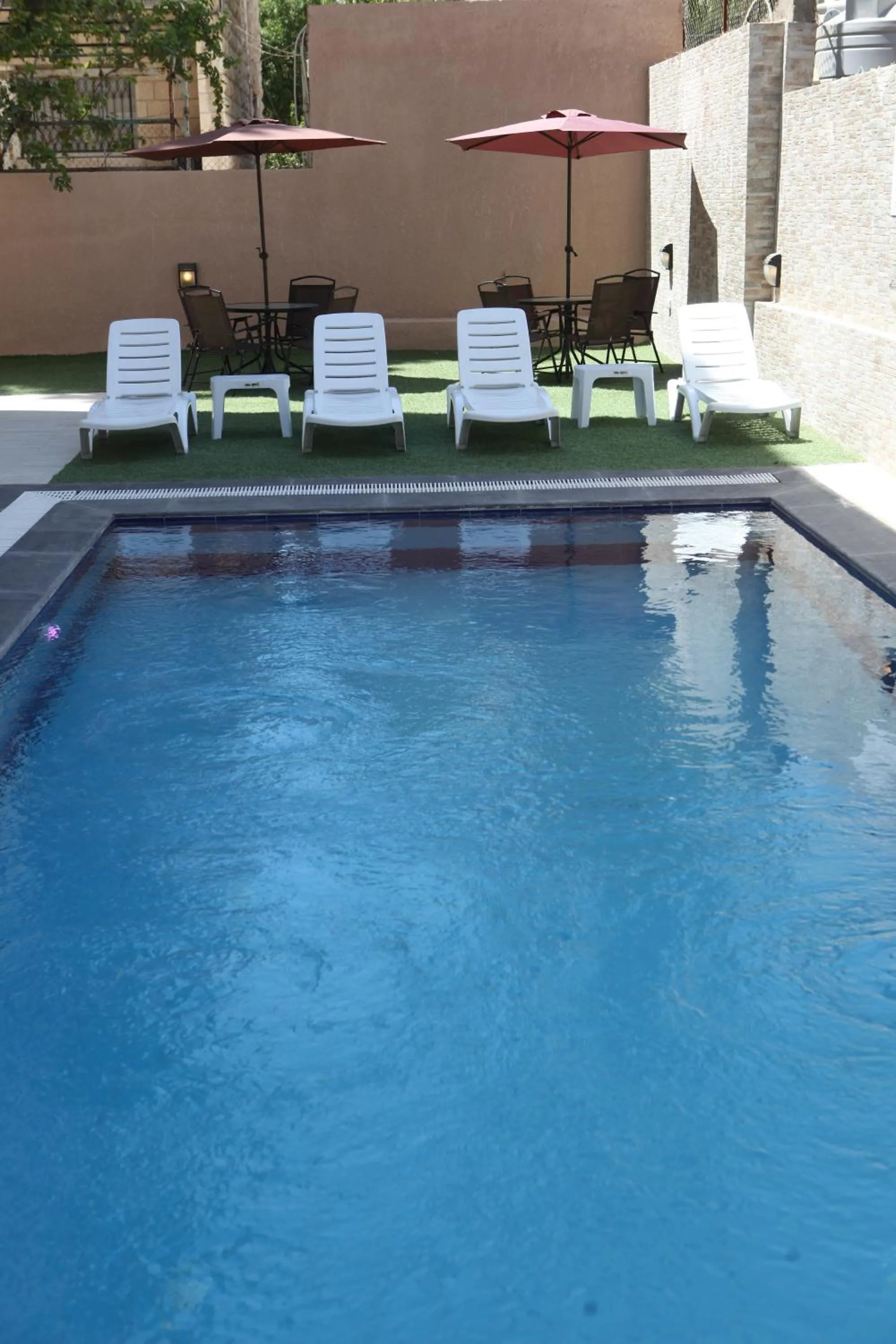 Swimming pool in Almond Hotel Apartments