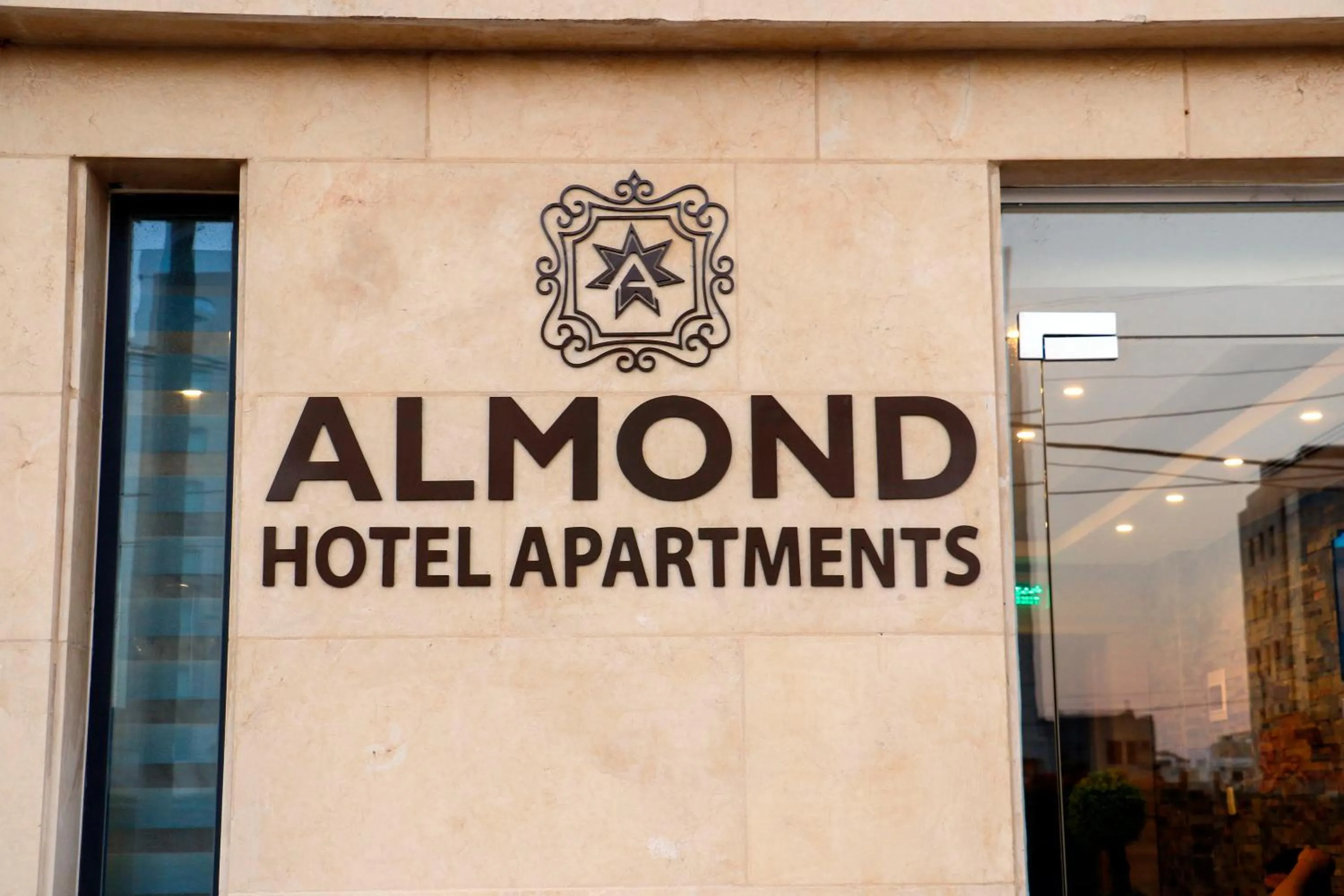 Property logo or sign in Almond Hotel Apartments