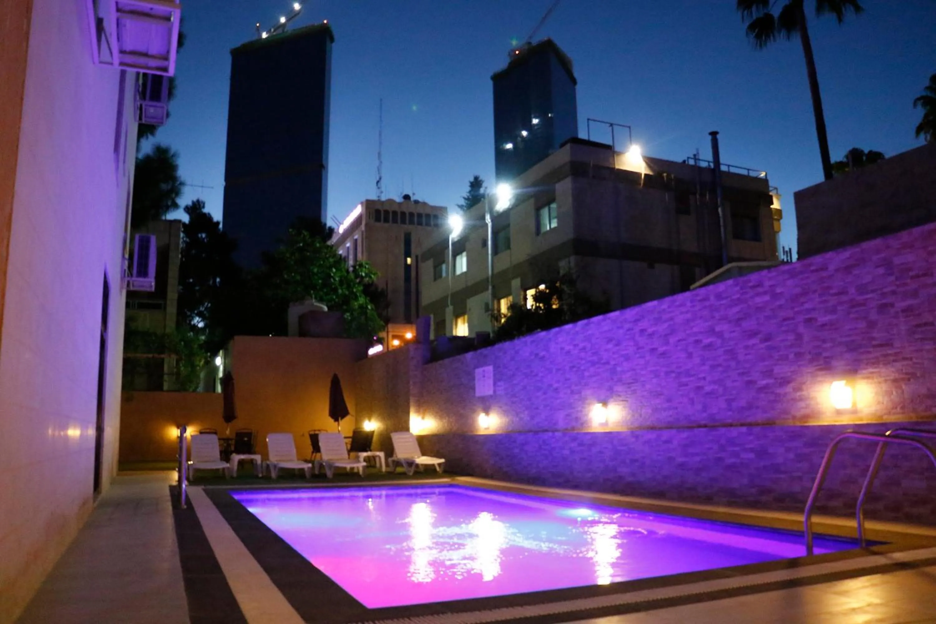 Swimming pool in Almond Hotel Apartments