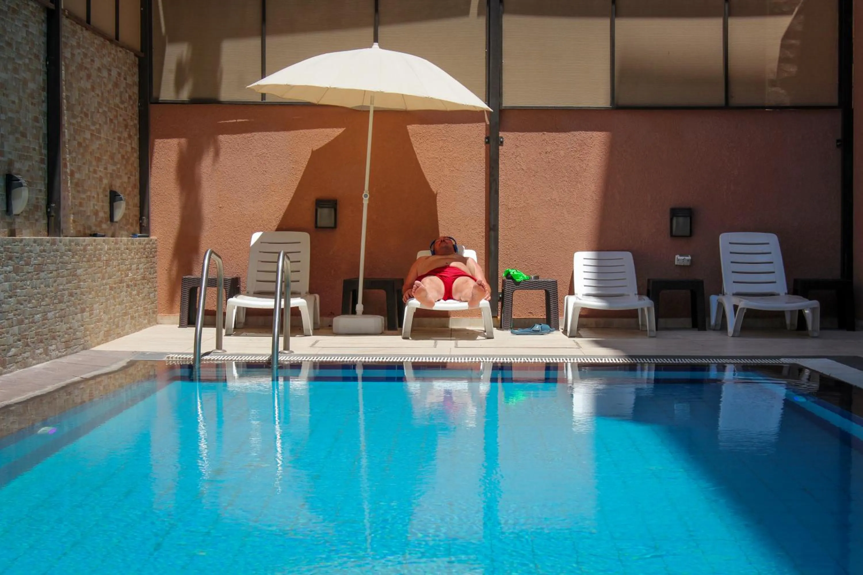Swimming pool in Almond Hotel Apartments