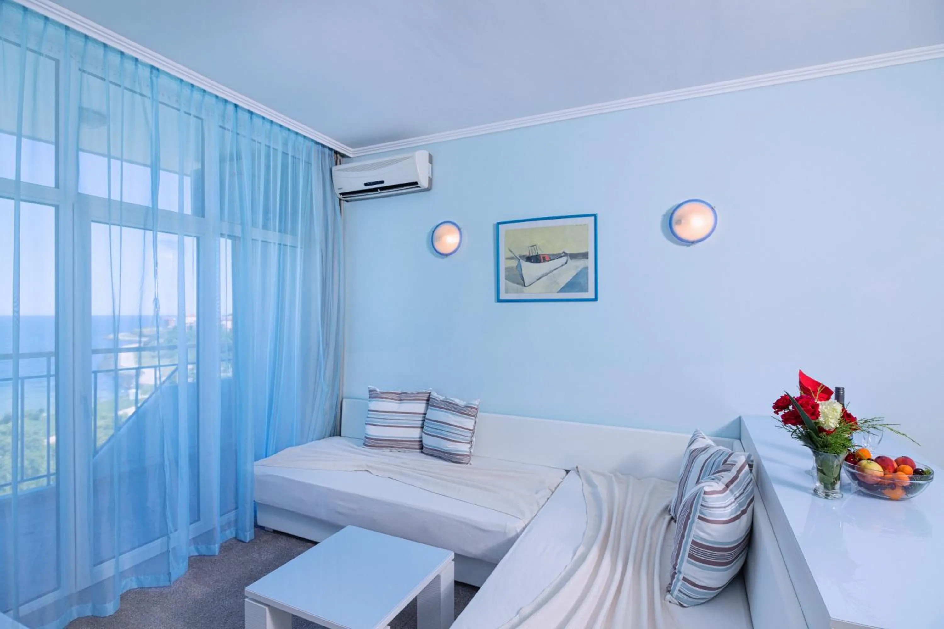 Seating area, Bed in Hotel Perla Beach Club - All Inclusive