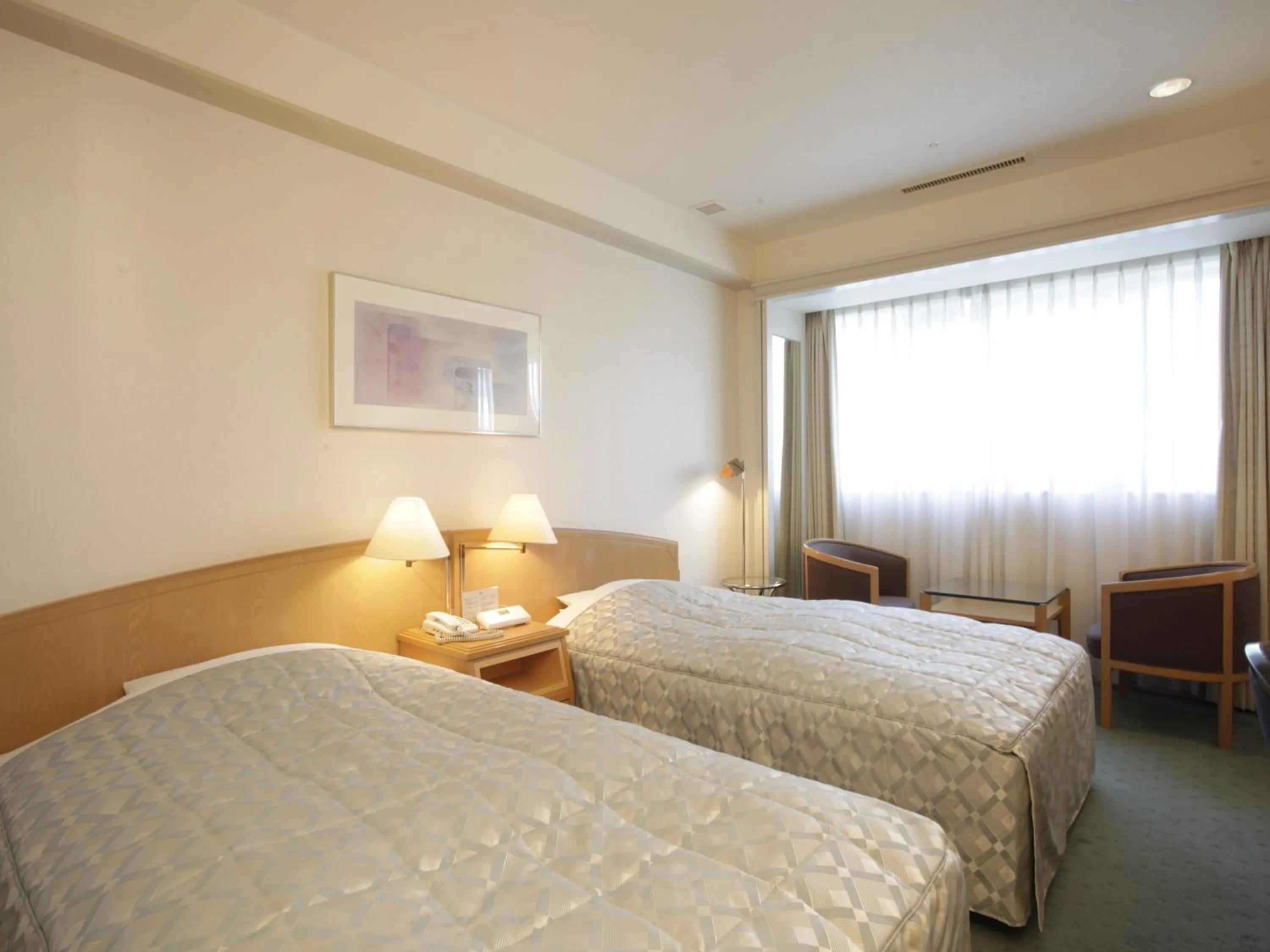 Bed in Jasmac Plaza Hotel