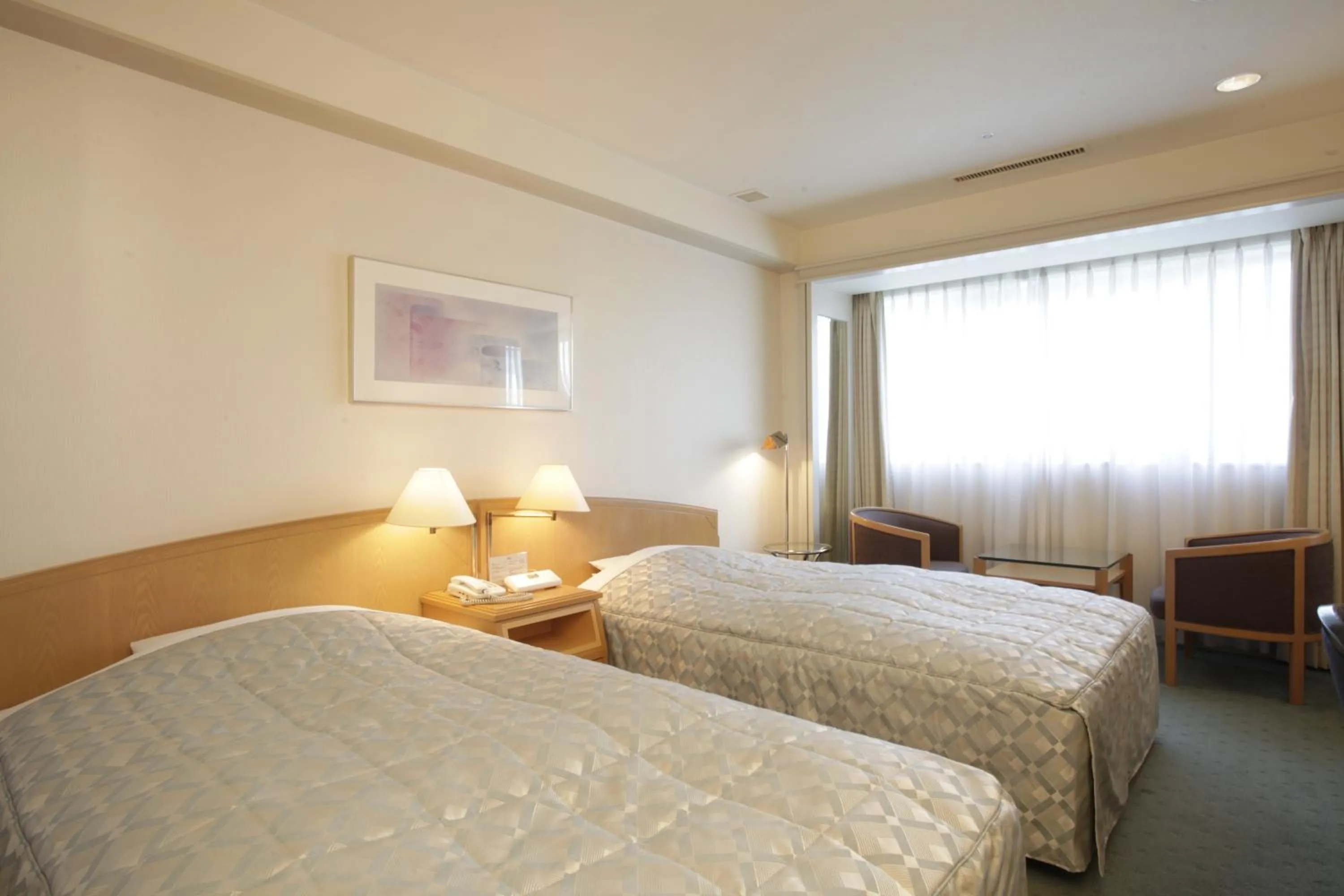 Bed in Jasmac Plaza Hotel