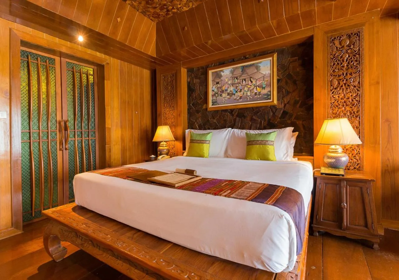 Bed in Santhiya Koh Phangan Resort and Spa