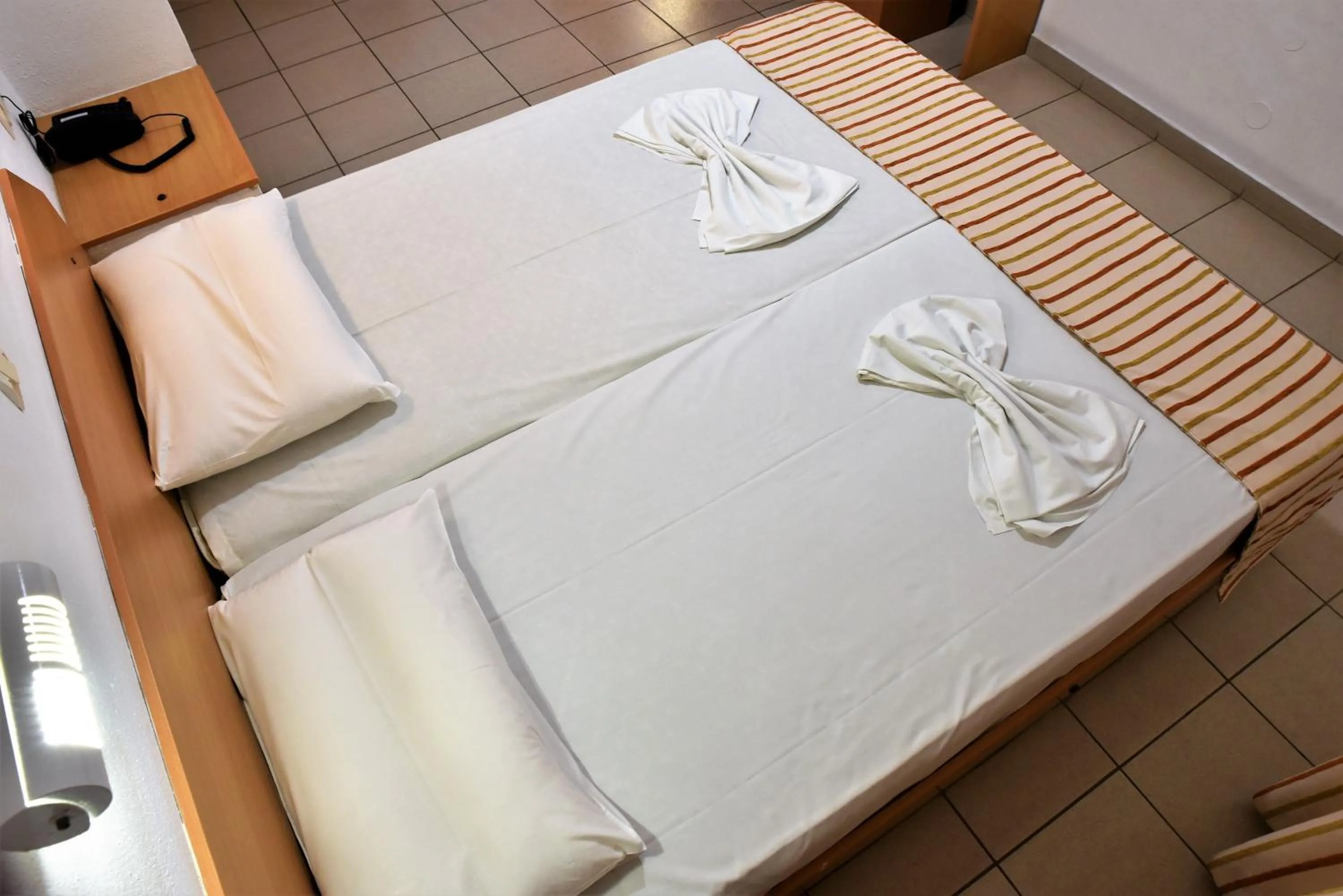 Bed in Ideal Hotel
