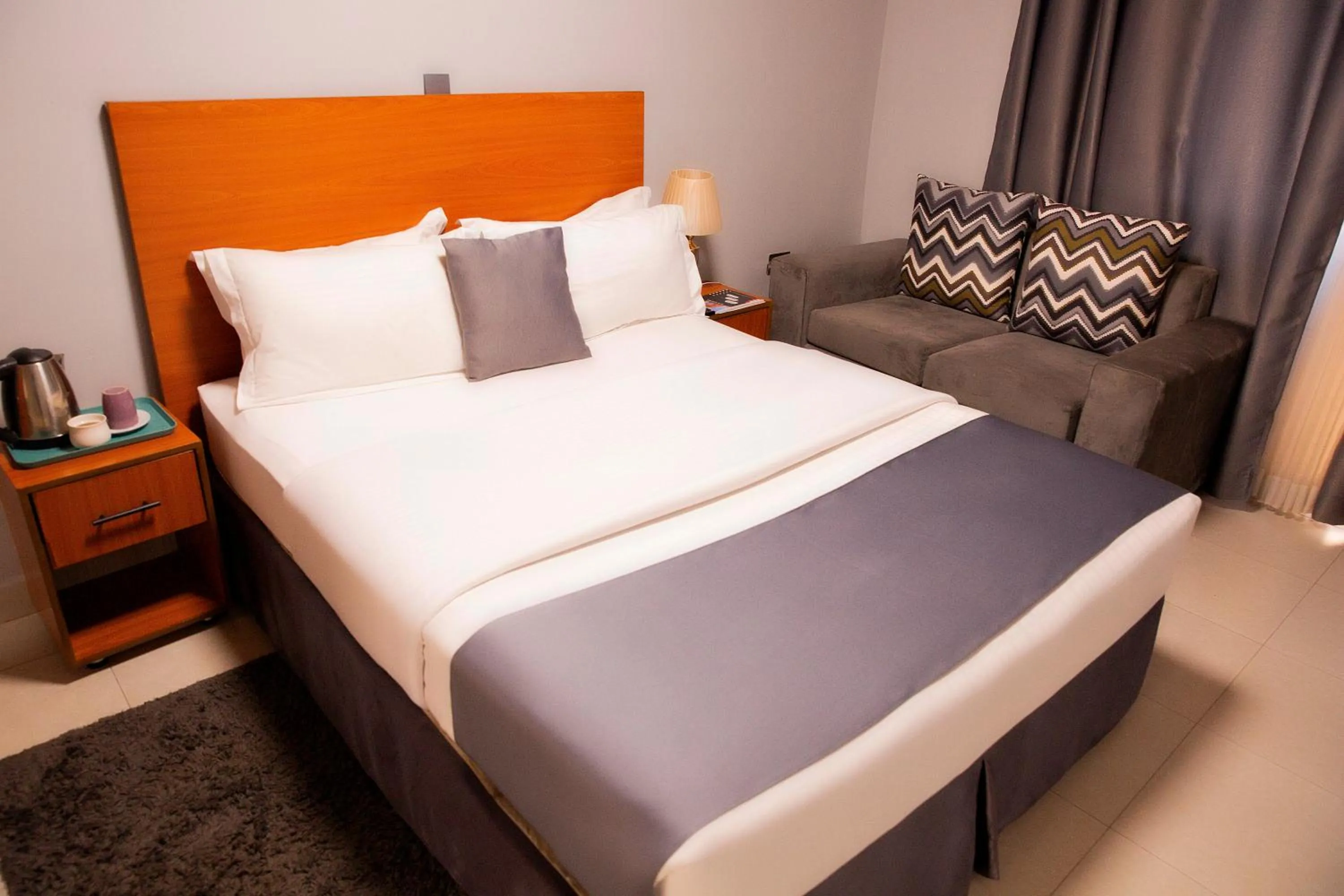 Bed in Romalo Hotel & Apartments