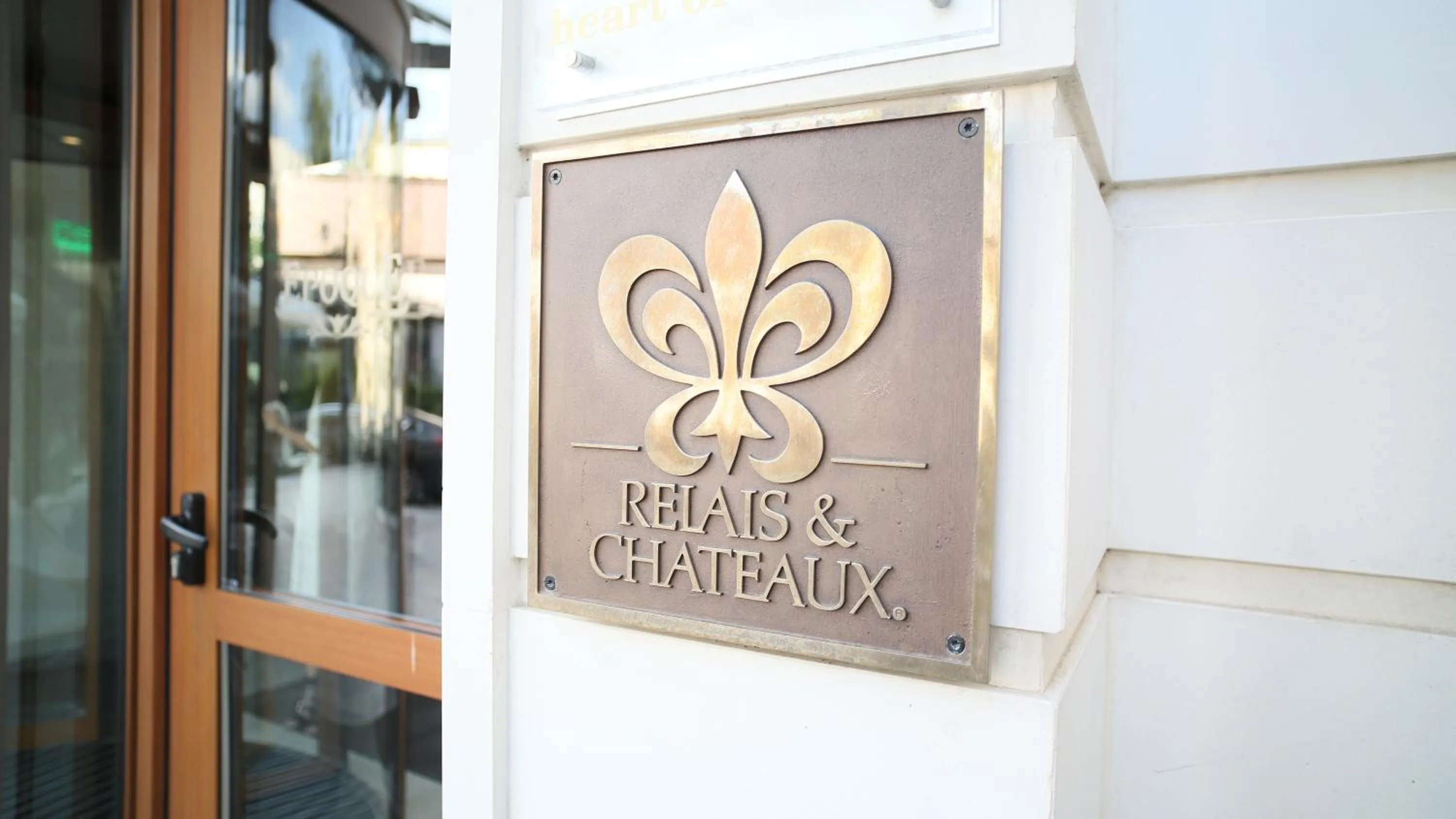 Property logo or sign in Epoque Hotel - Relais & Chateaux