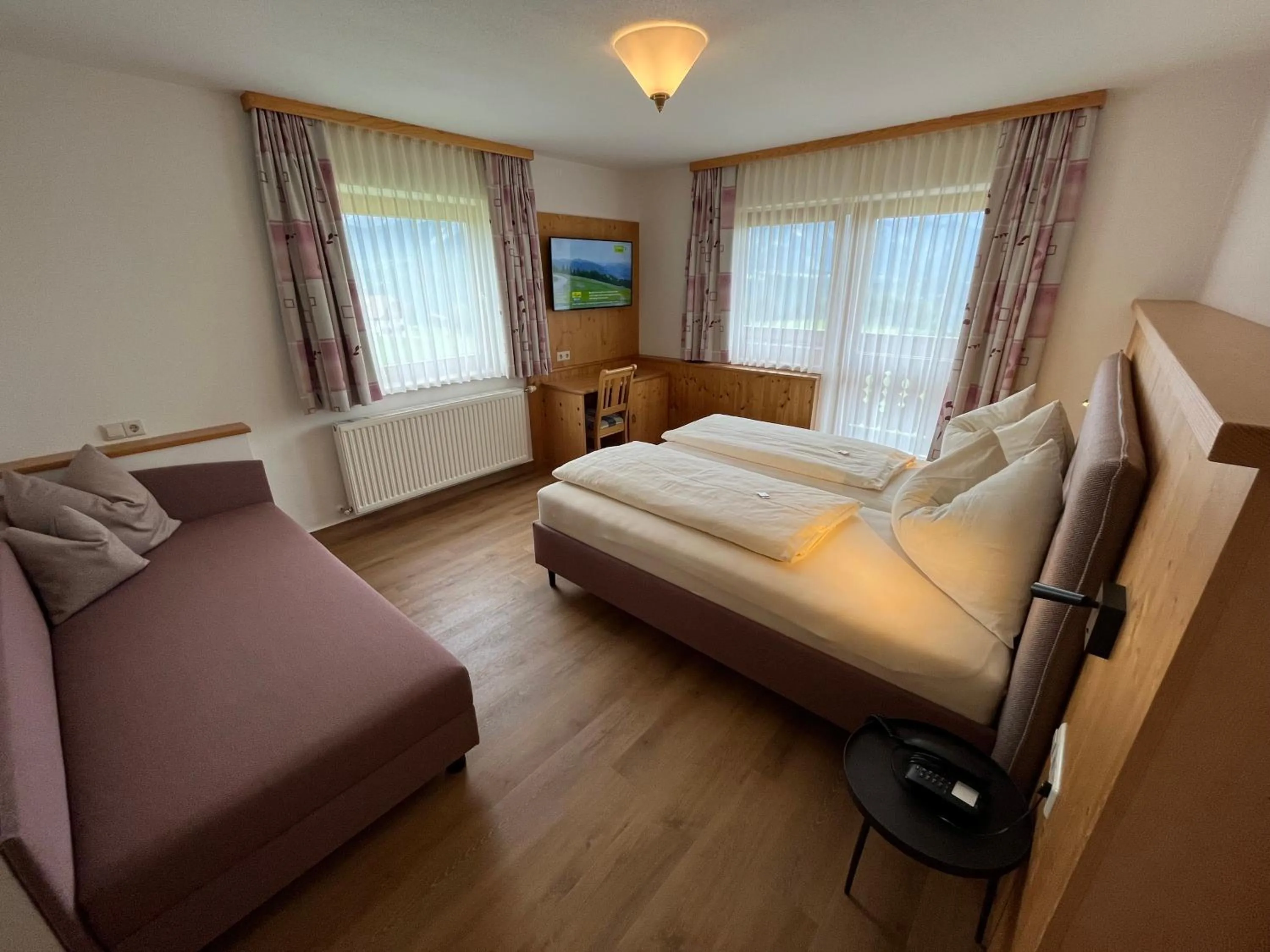 Seating area, Bed in Hotel Waldfrieden