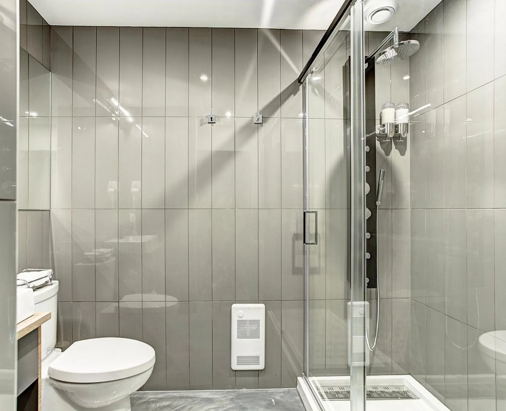 Shower in Pierce Boutique Apartments by Simplissimmo