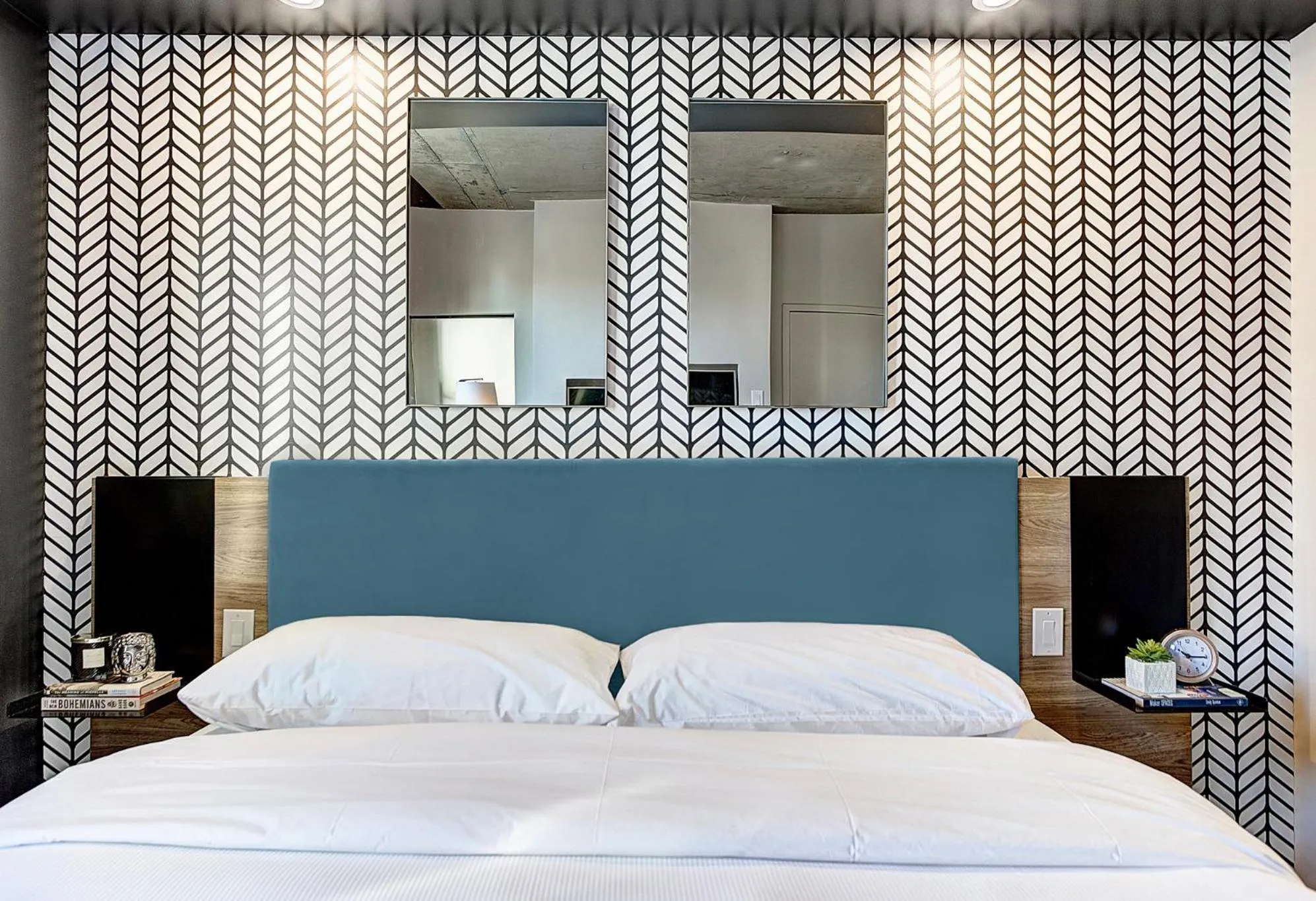 Bed in Pierce Boutique Apartments by Simplissimmo