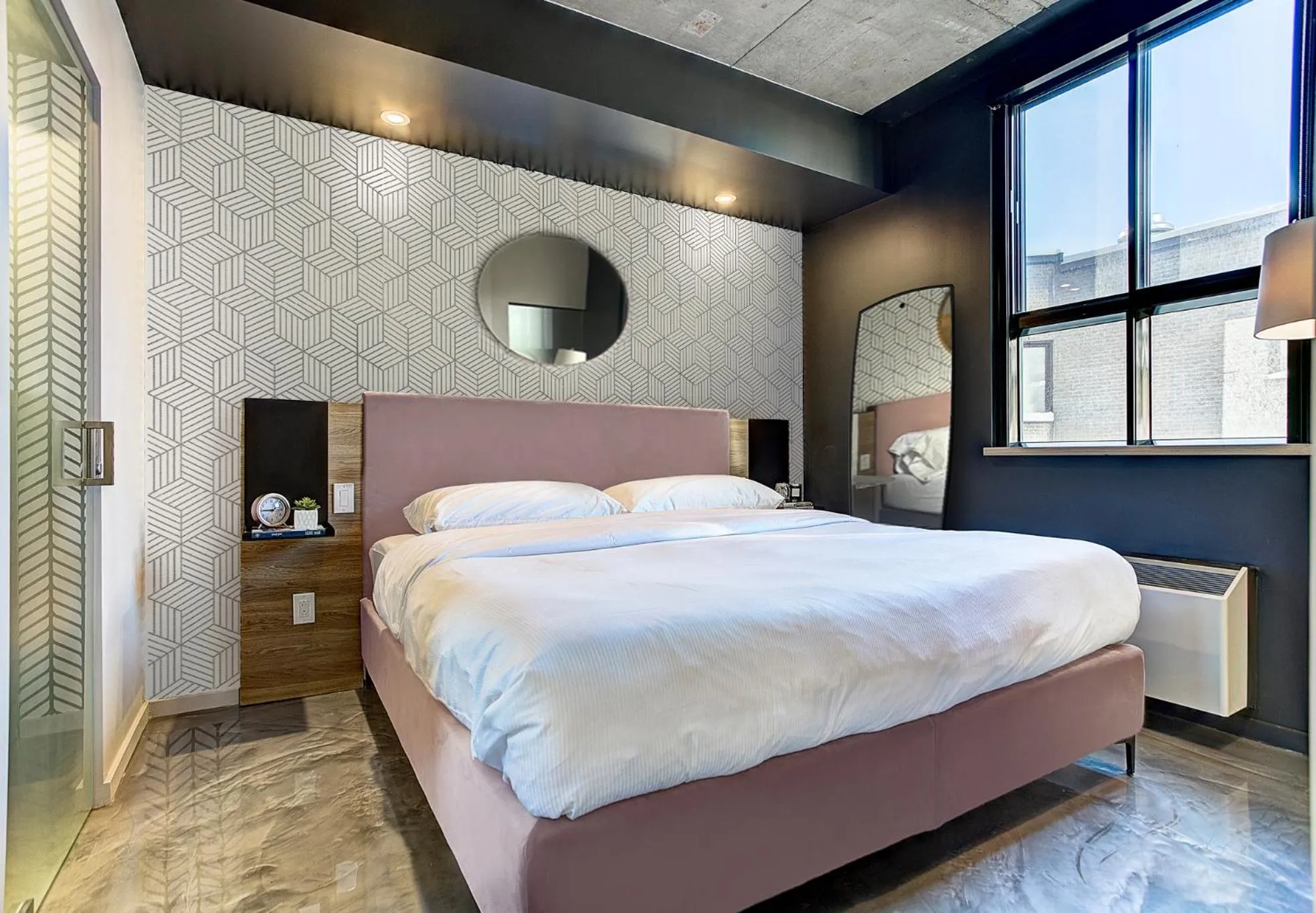 Bed in Pierce Boutique Apartments by Simplissimmo