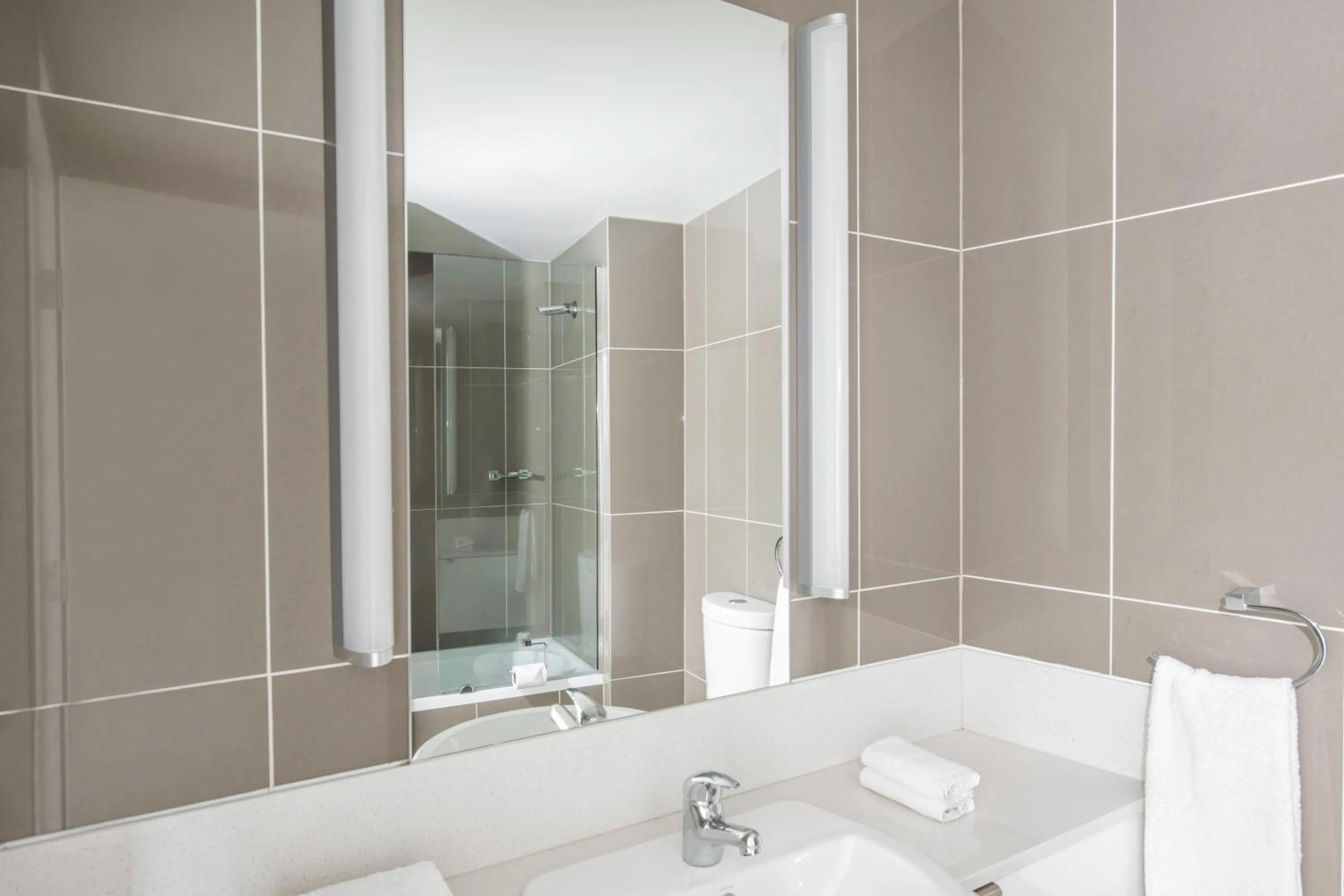 Bathroom in Mantra Collins Hotel