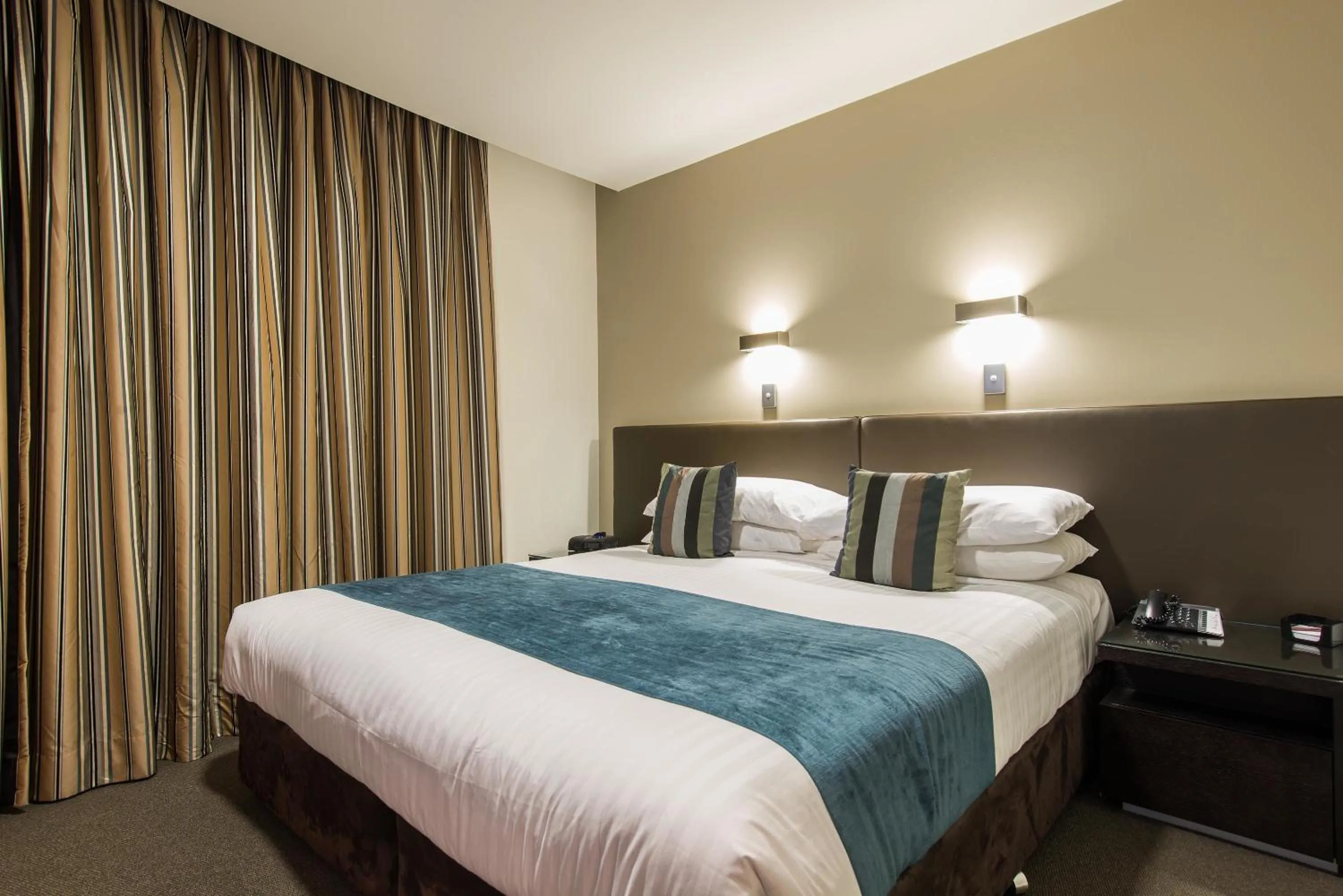 Bedroom, Bed in Mantra Collins Hotel