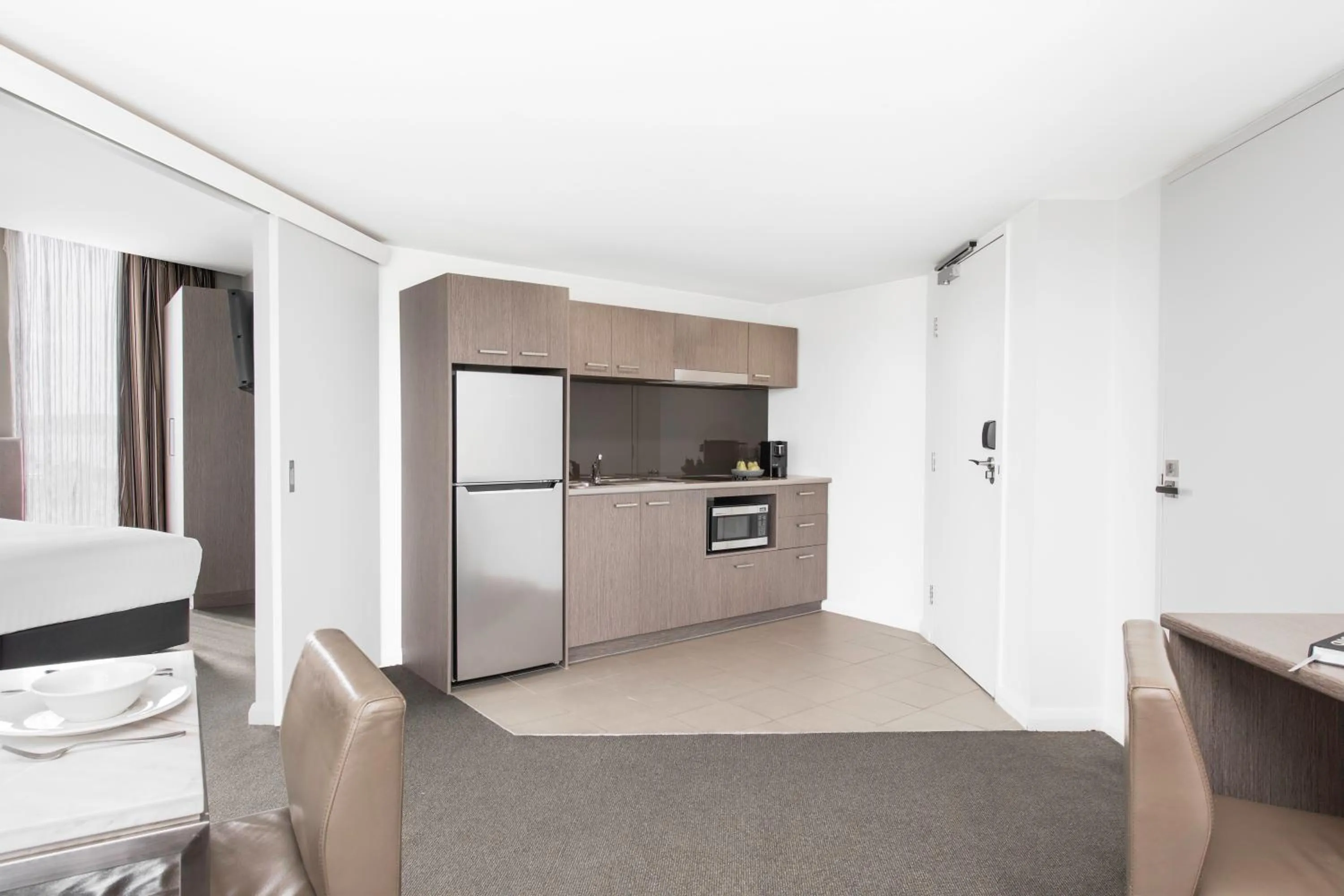 Kitchen or kitchenette in Mantra Collins Hotel