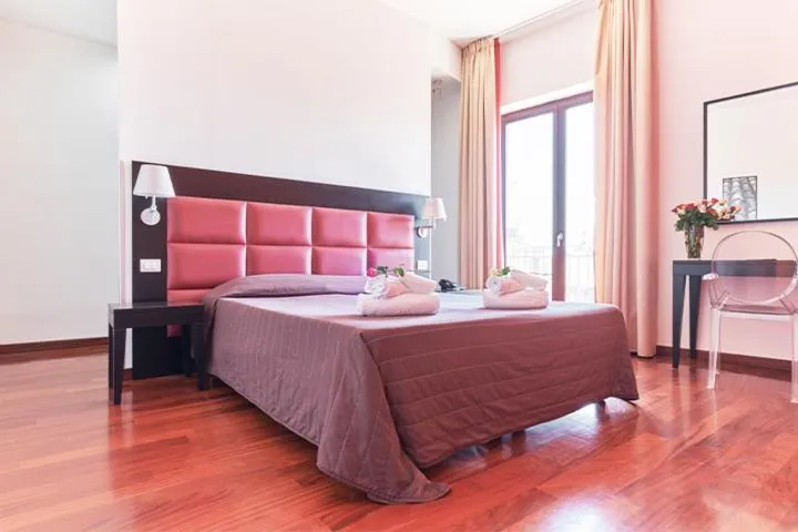 Bed in La Chicca Palace Hotel