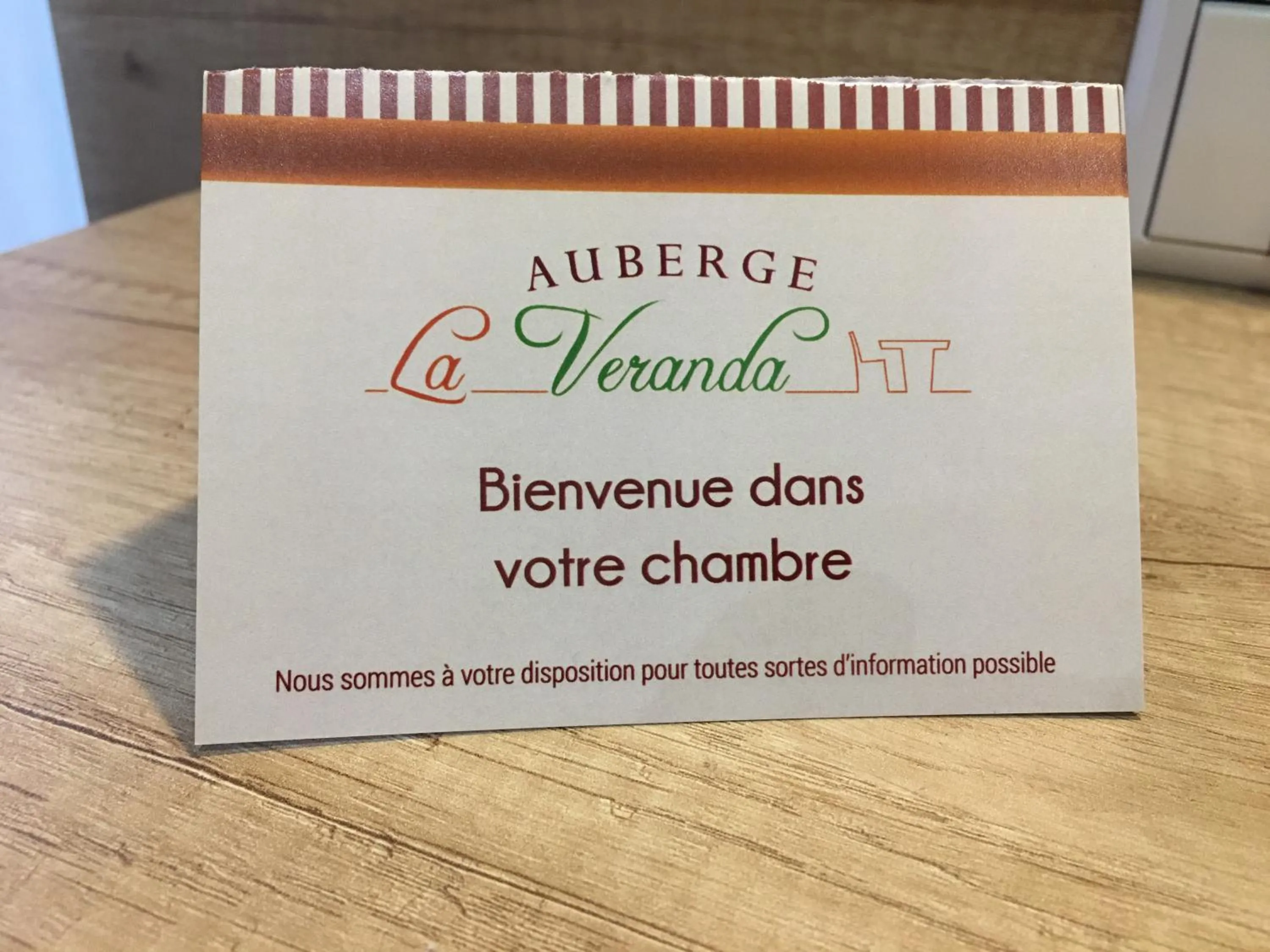 Property logo or sign in Auberge La Veranda