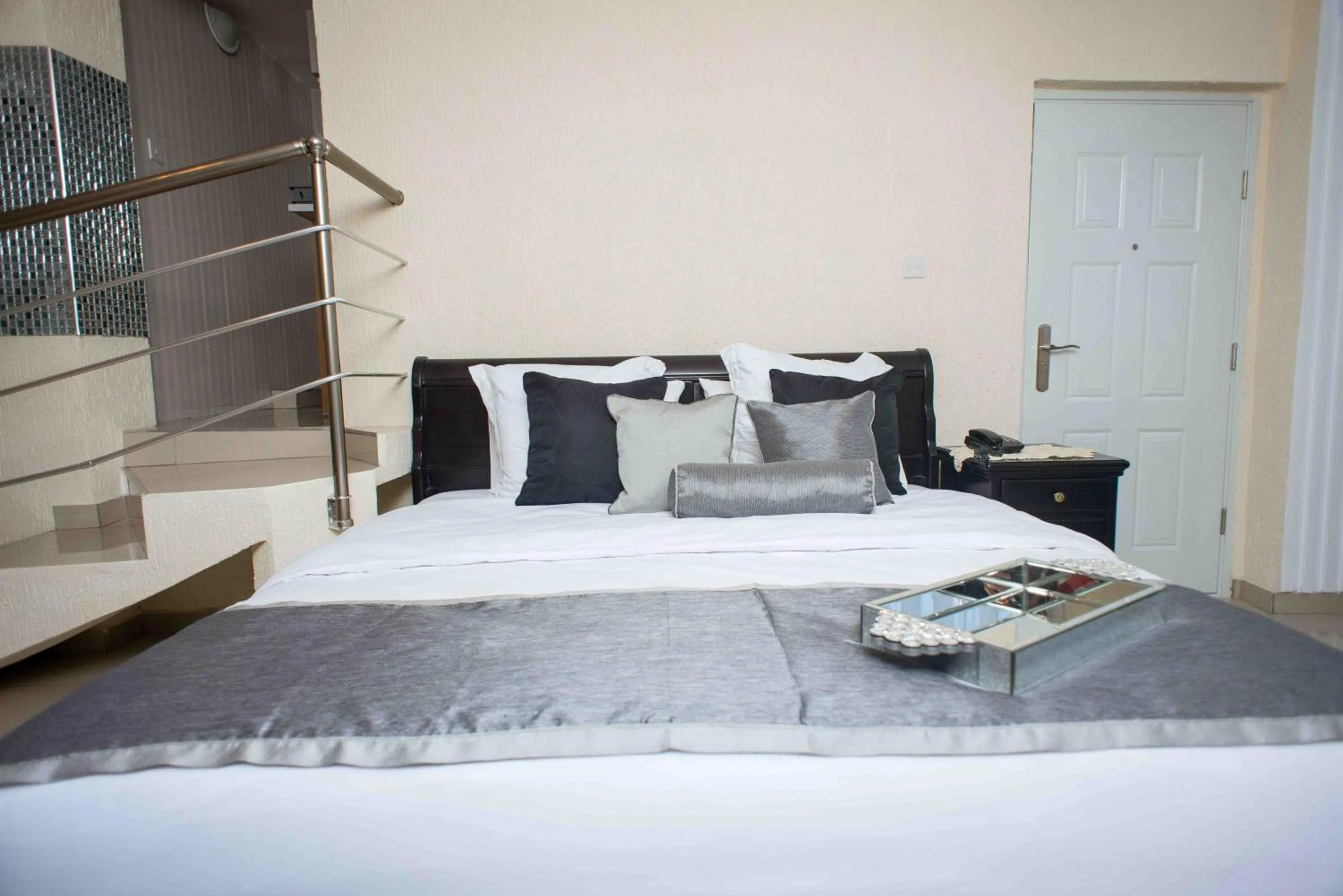 Bed in The Ritzz Exclusive Guest House