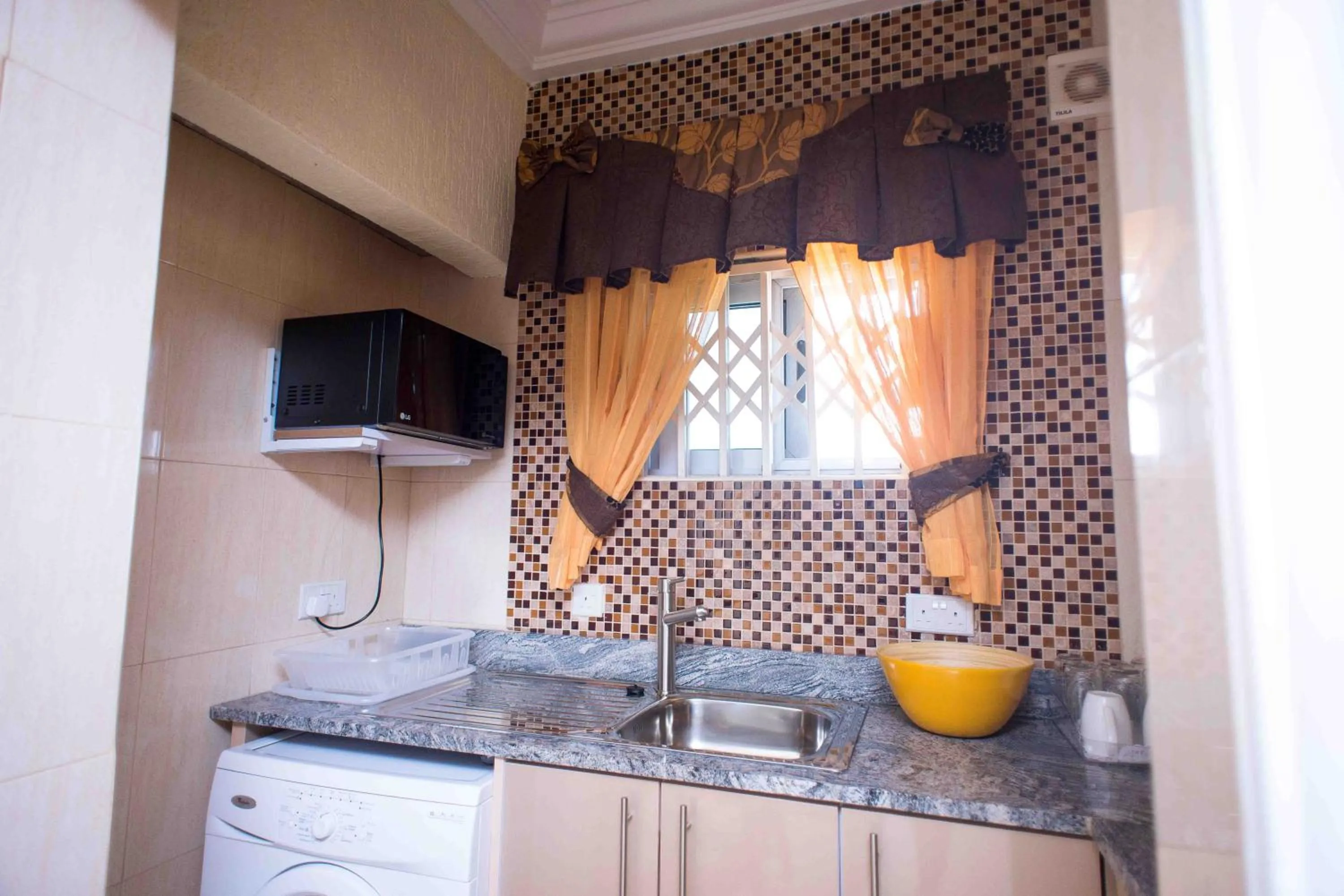 Kitchen or kitchenette in The Ritzz Exclusive Guest House