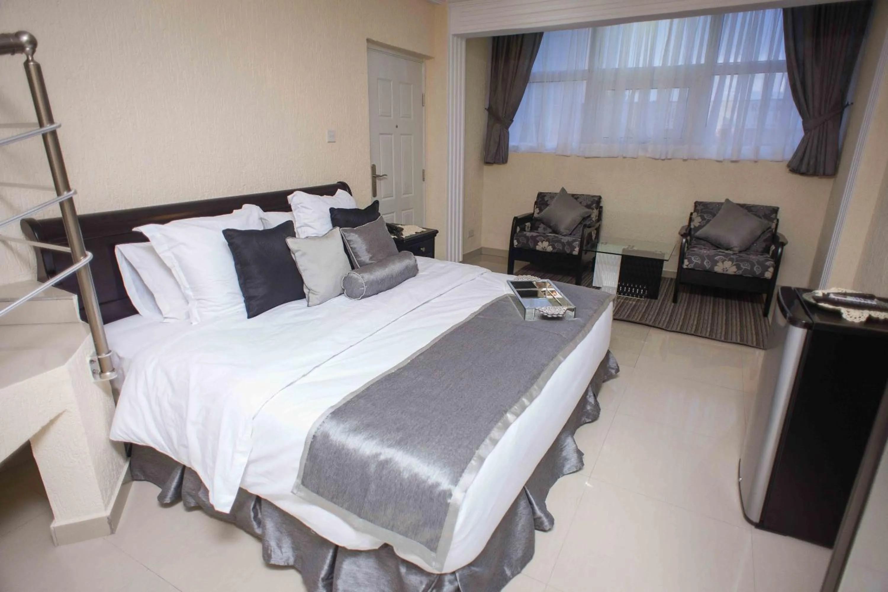 Bed in The Ritzz Exclusive Guest House