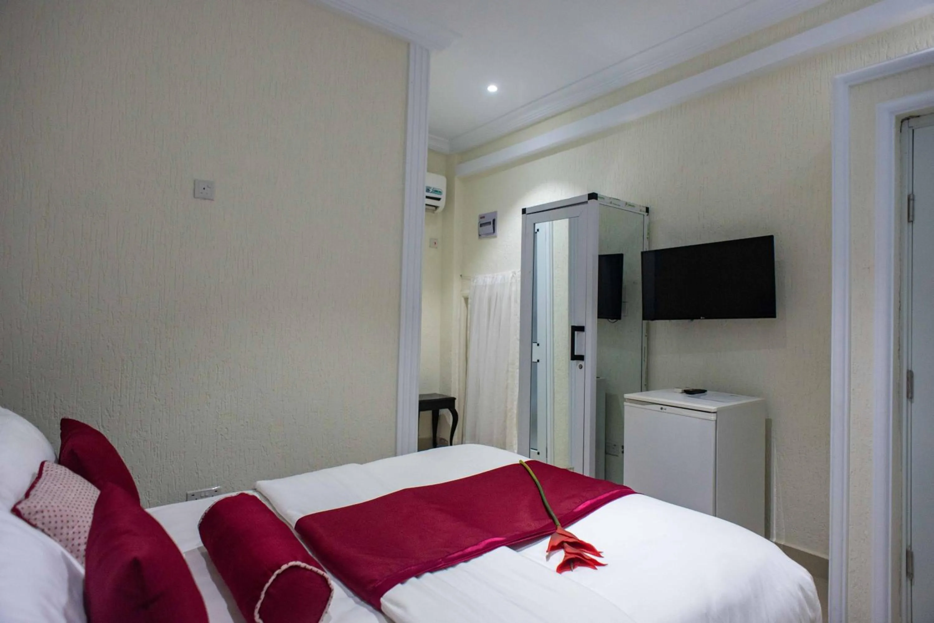 Bed in The Ritzz Exclusive Guest House