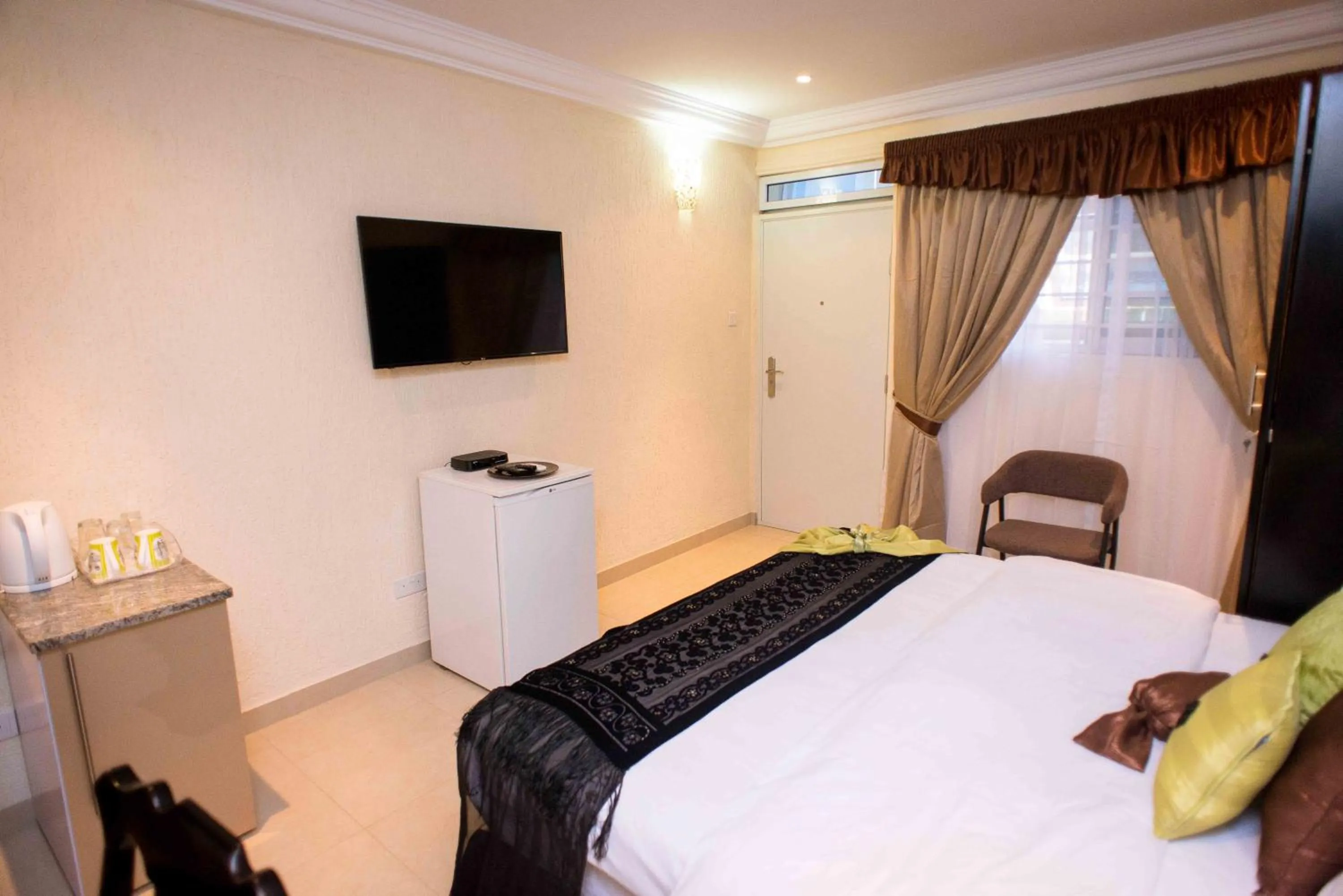 Bed in The Ritzz Exclusive Guest House