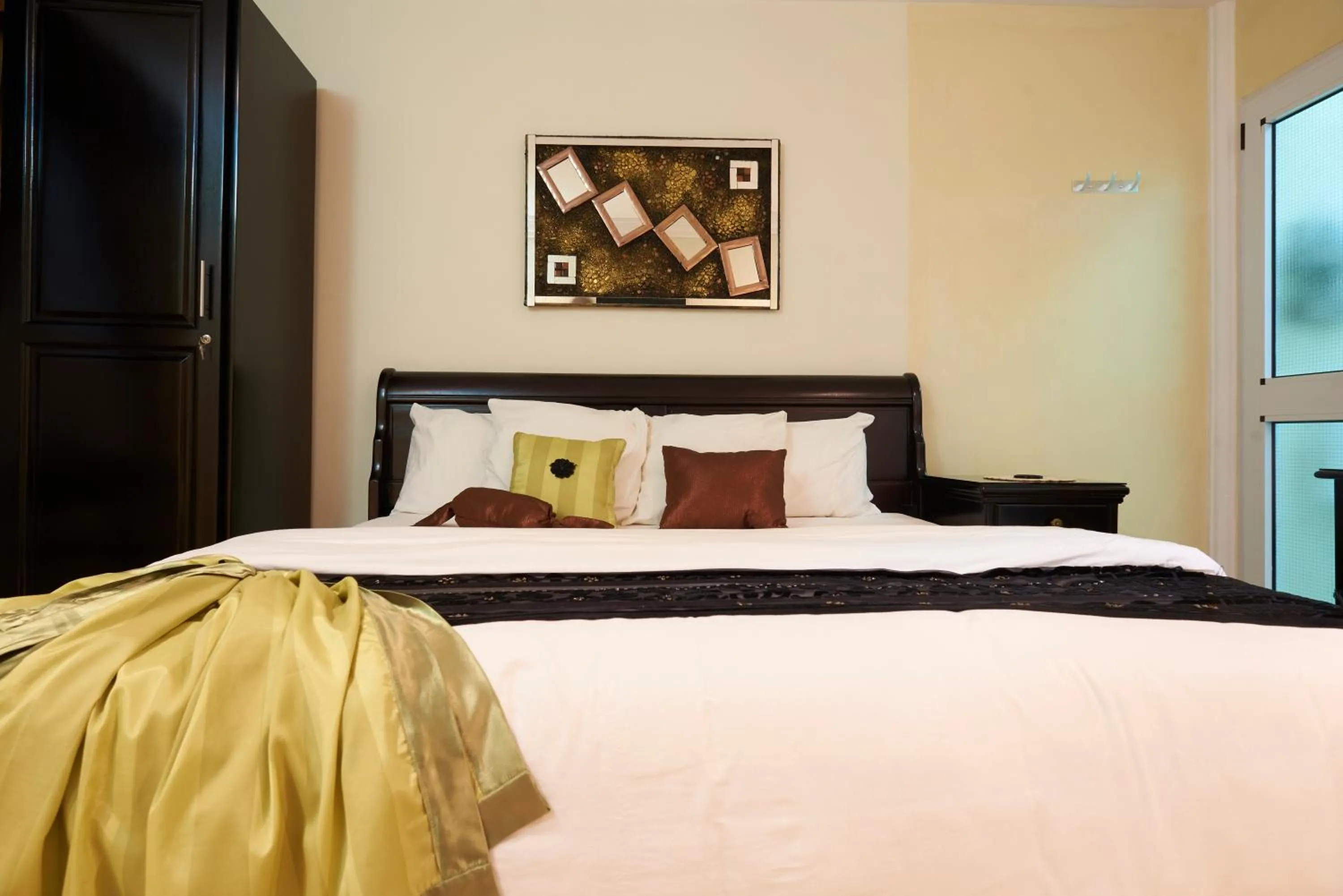 Bed in The Ritzz Exclusive Guest House