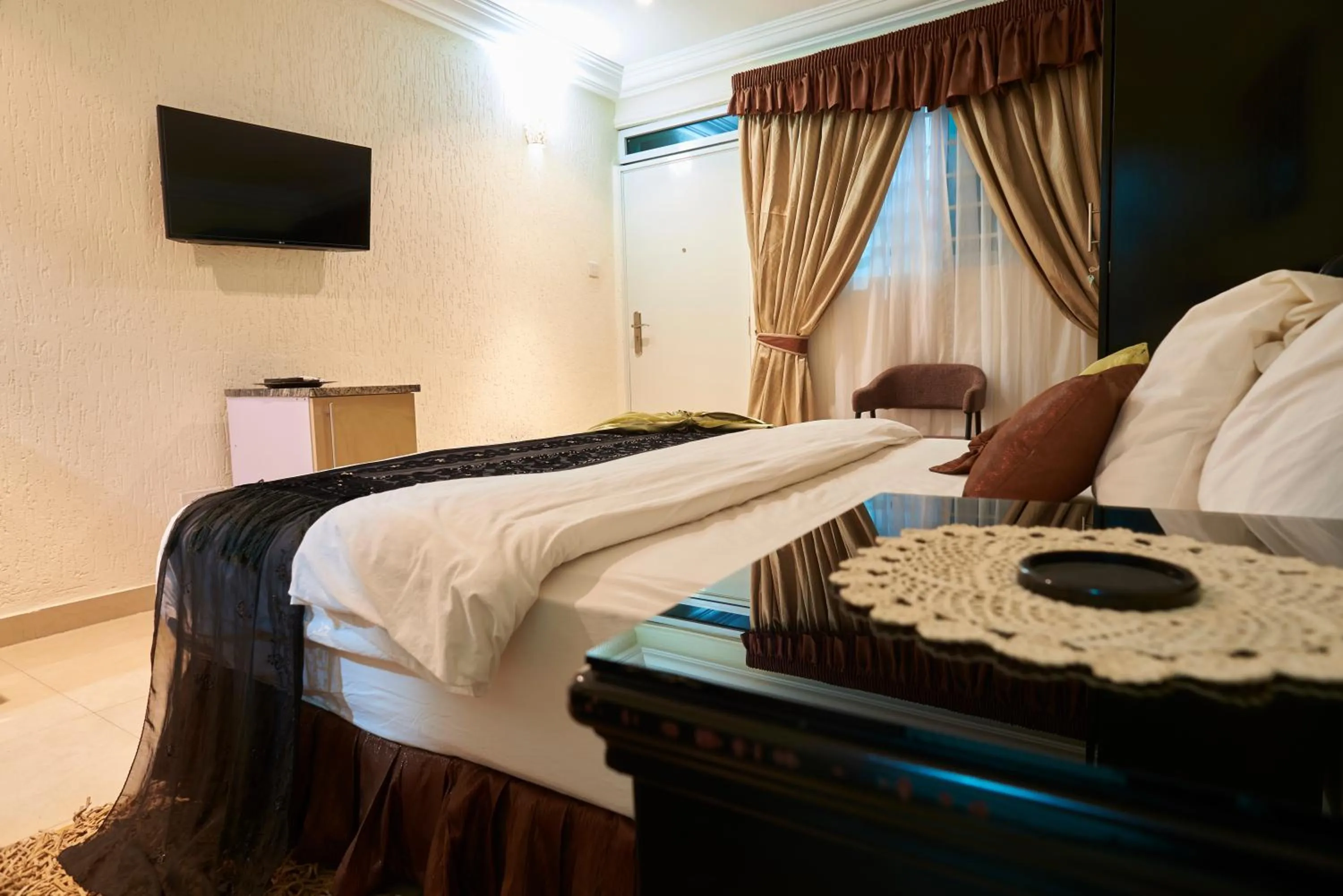 Bed in The Ritzz Exclusive Guest House