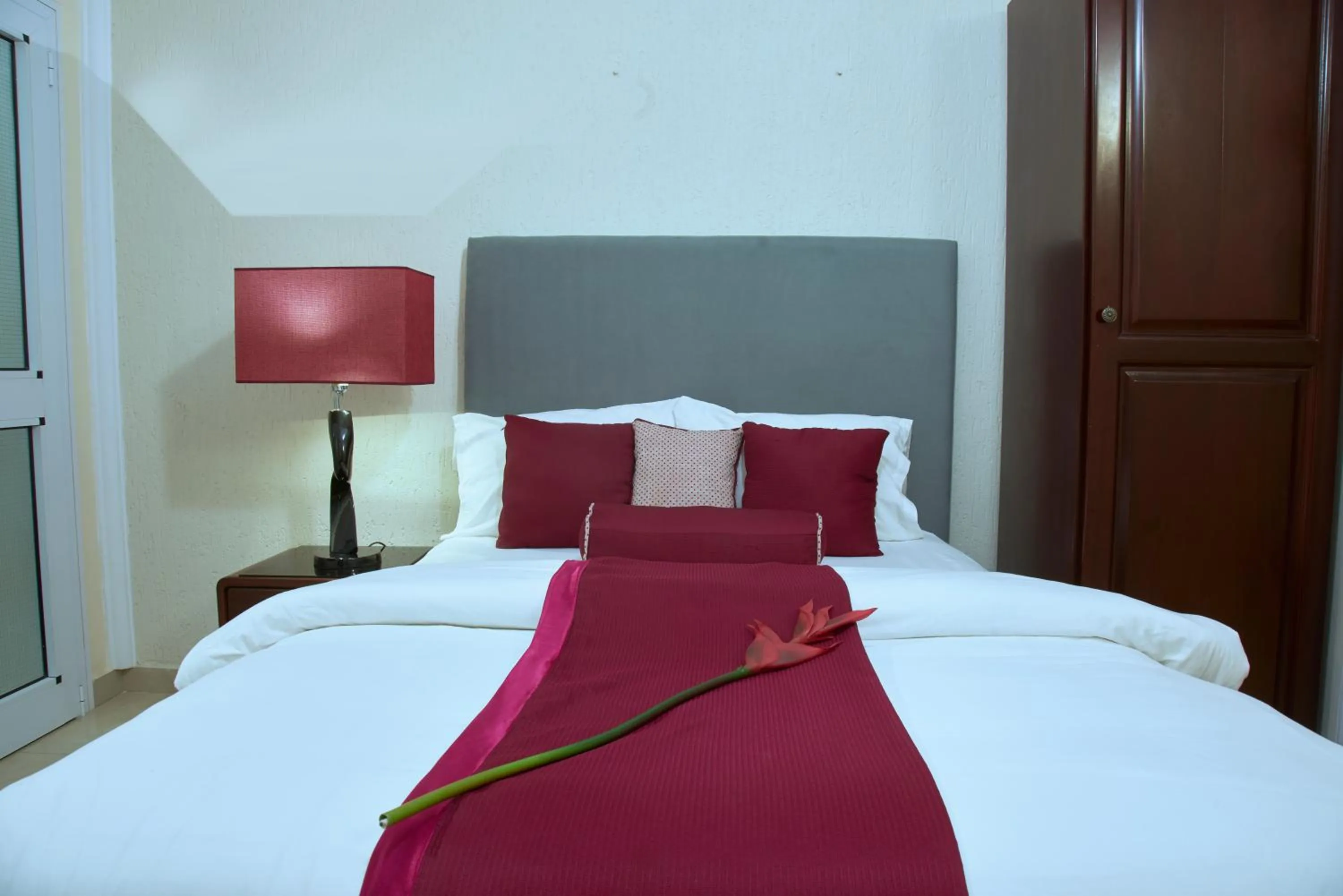 Bed in The Ritzz Exclusive Guest House