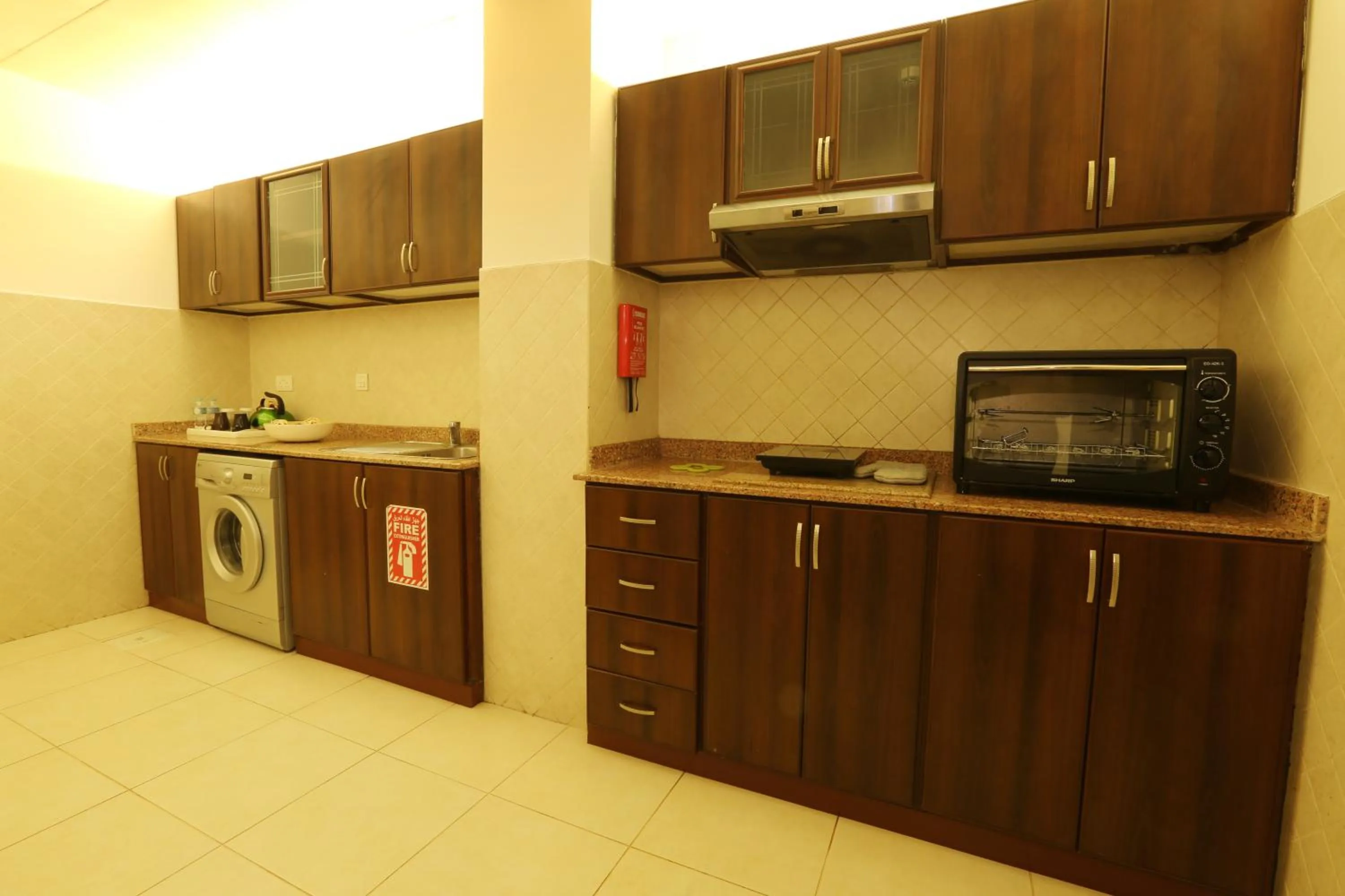 Kitchen or kitchenette in Corp Executive Hotel Doha Suites