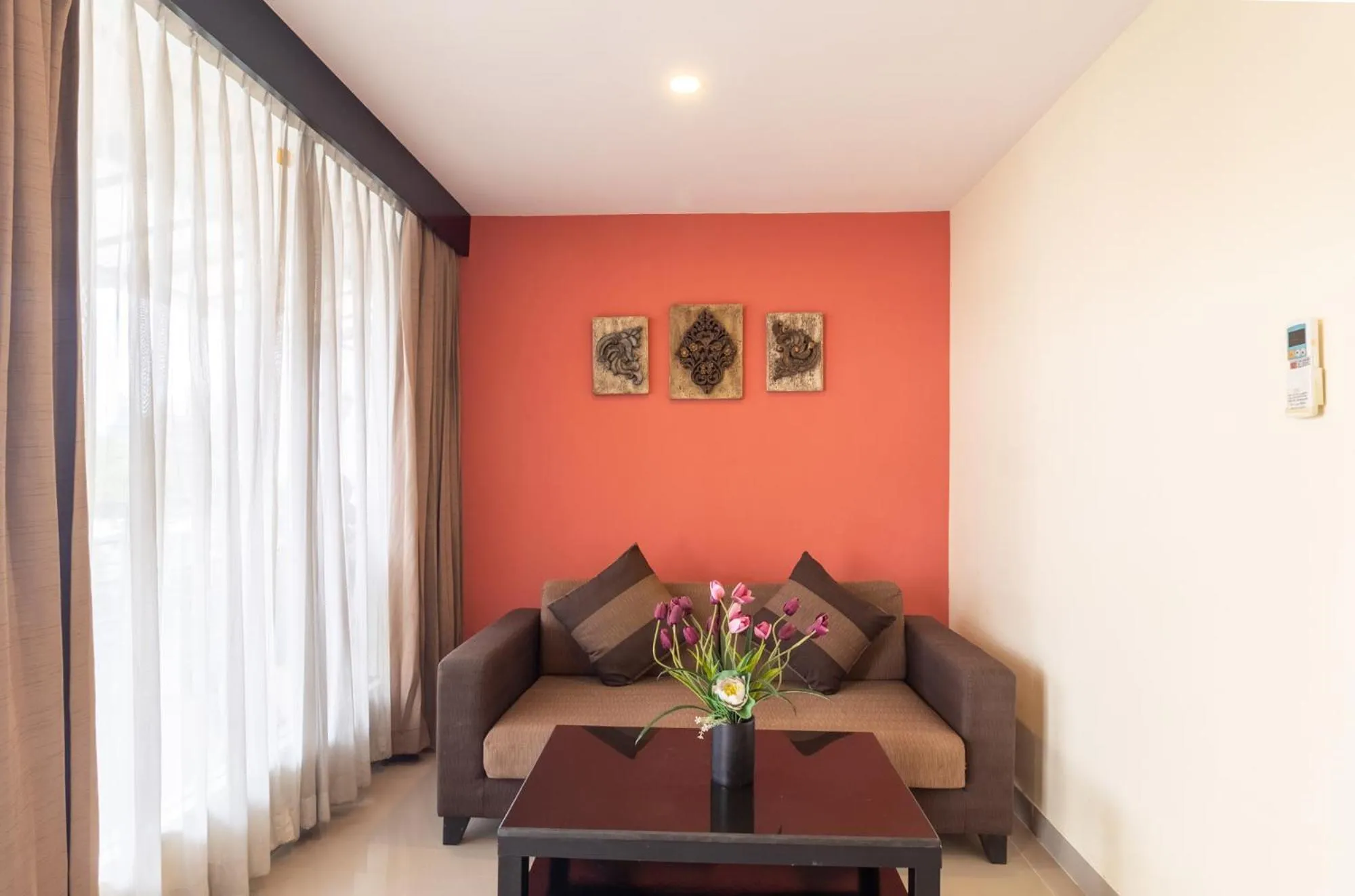 Living room in Boss Suites Nana Hotel