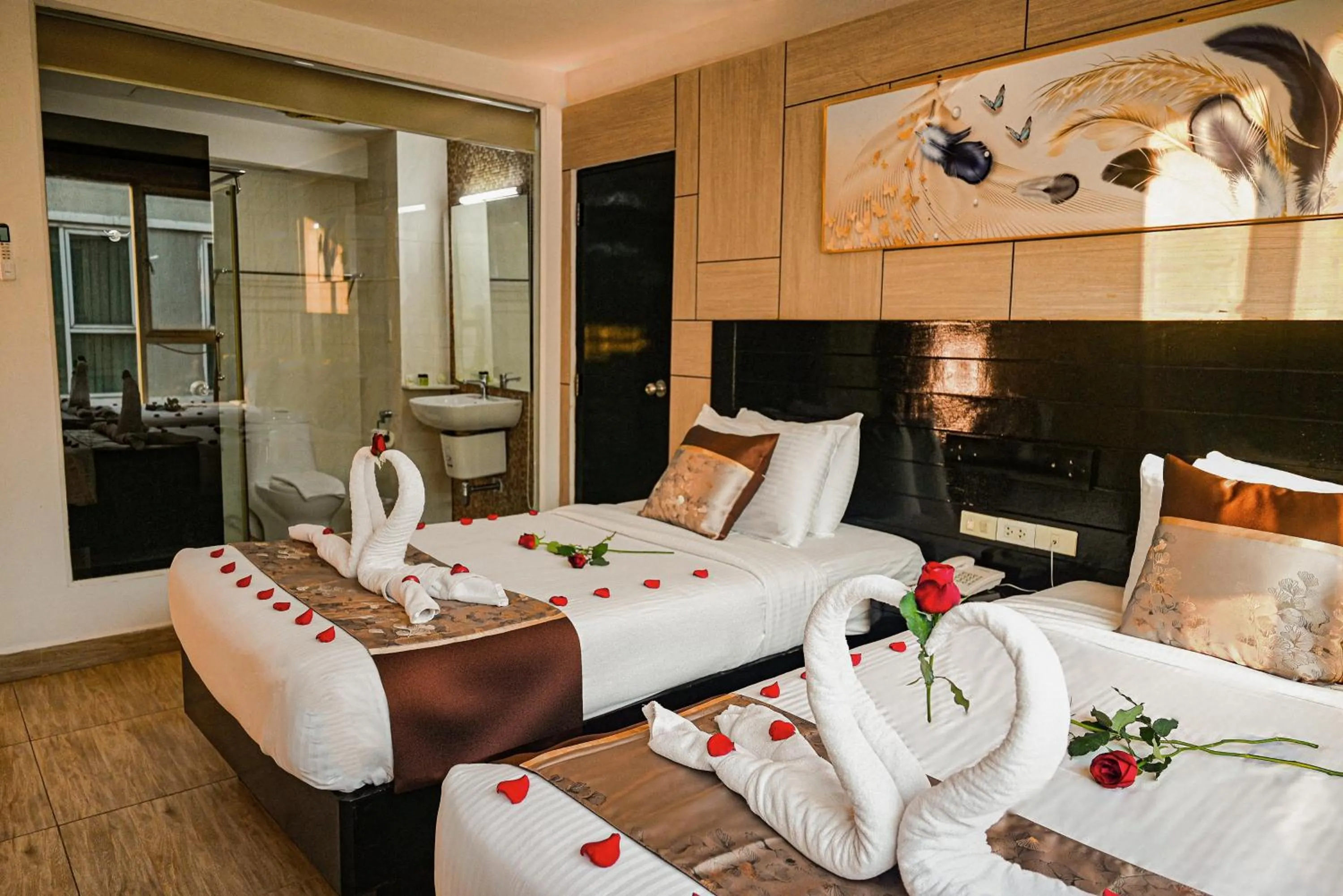 Bed in Boss Suites Nana Hotel