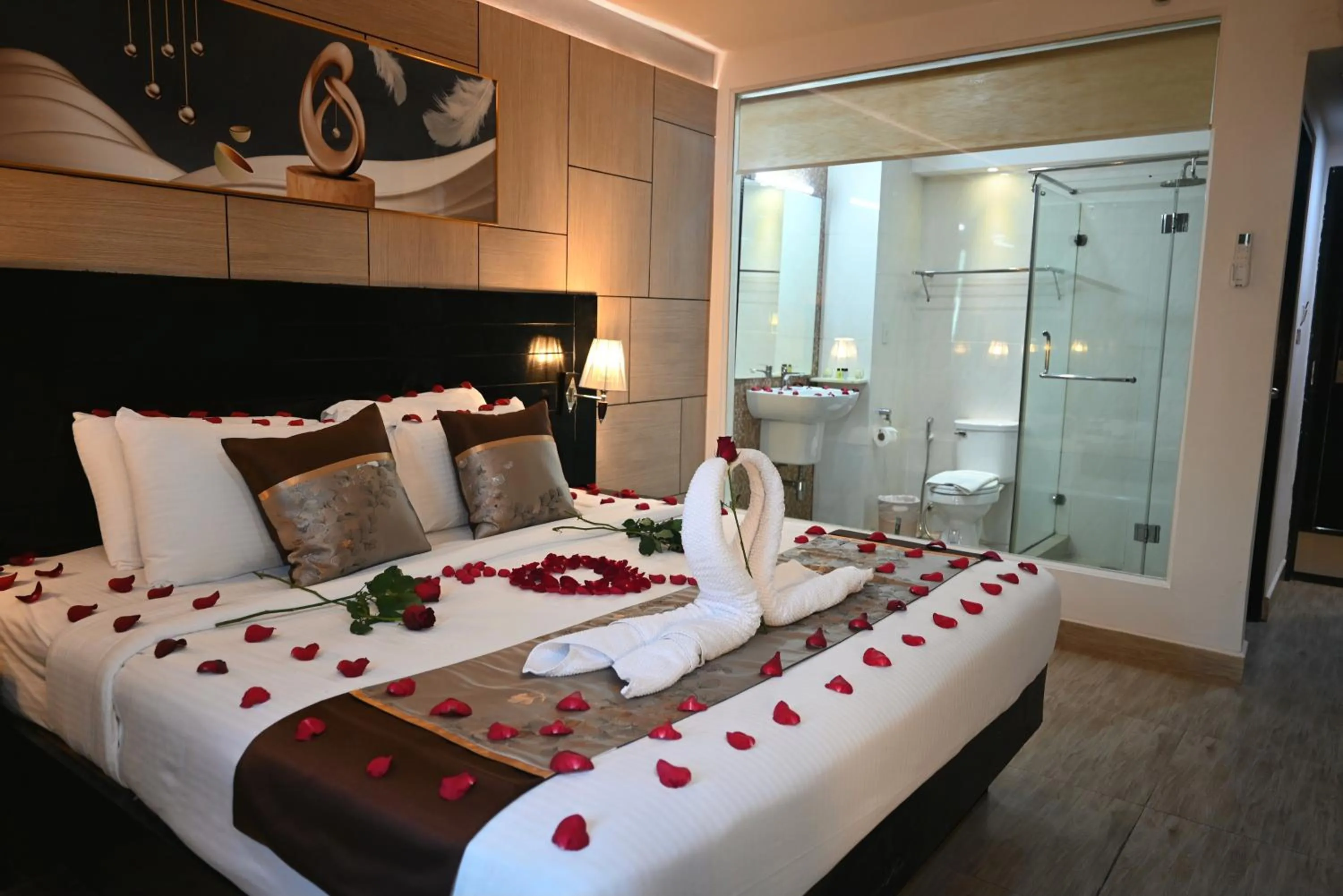 Bed in Boss Suites Nana Hotel