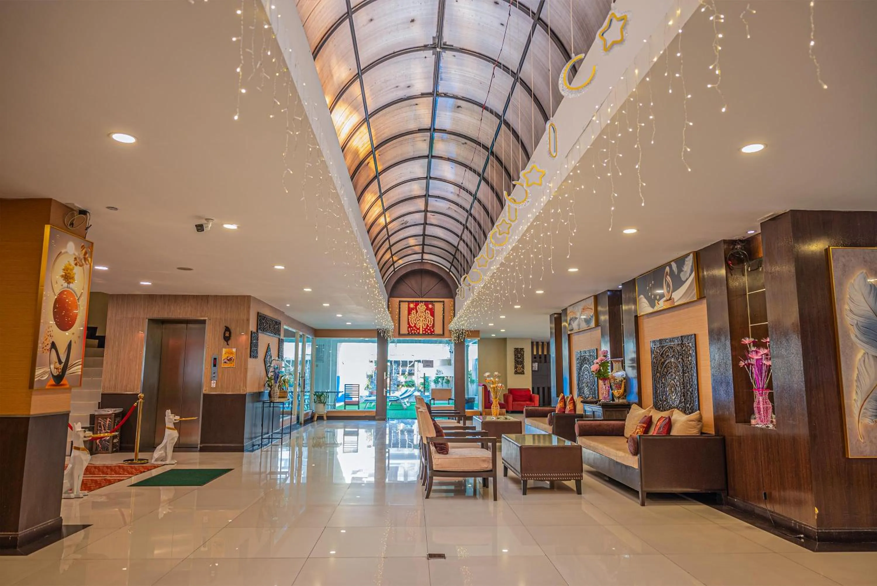 Seating area in Boss Suites Nana Hotel