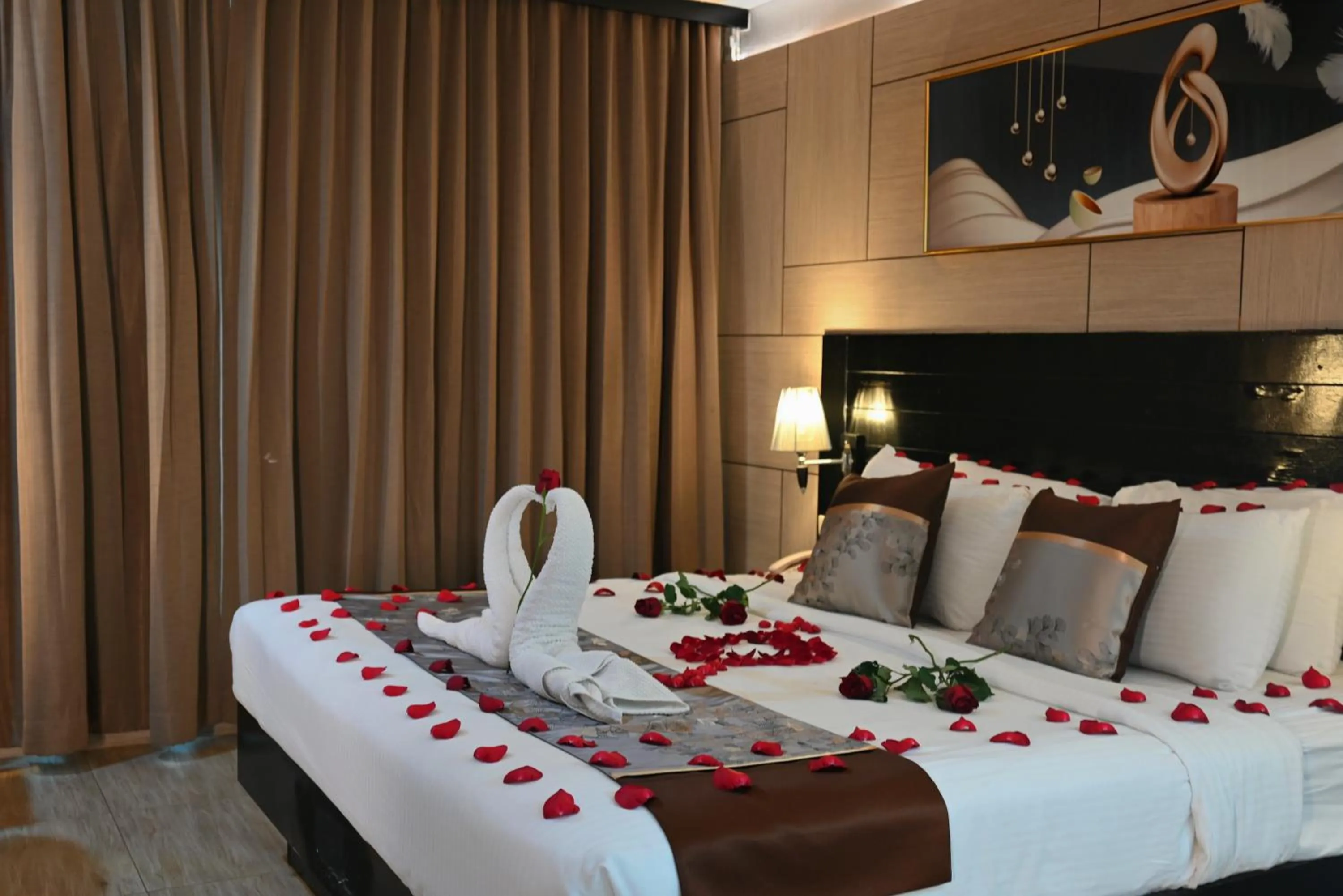 Bed in Boss Suites Nana Hotel