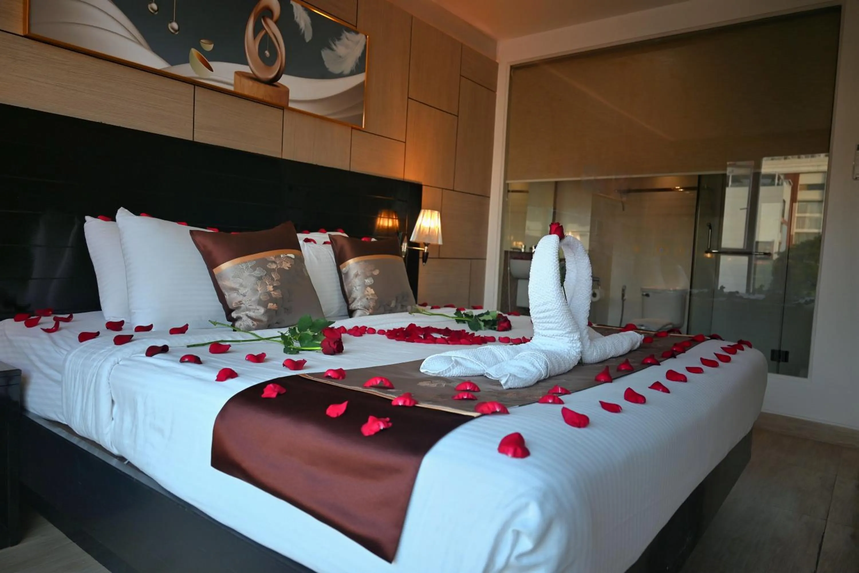 Bed in Boss Suites Nana Hotel