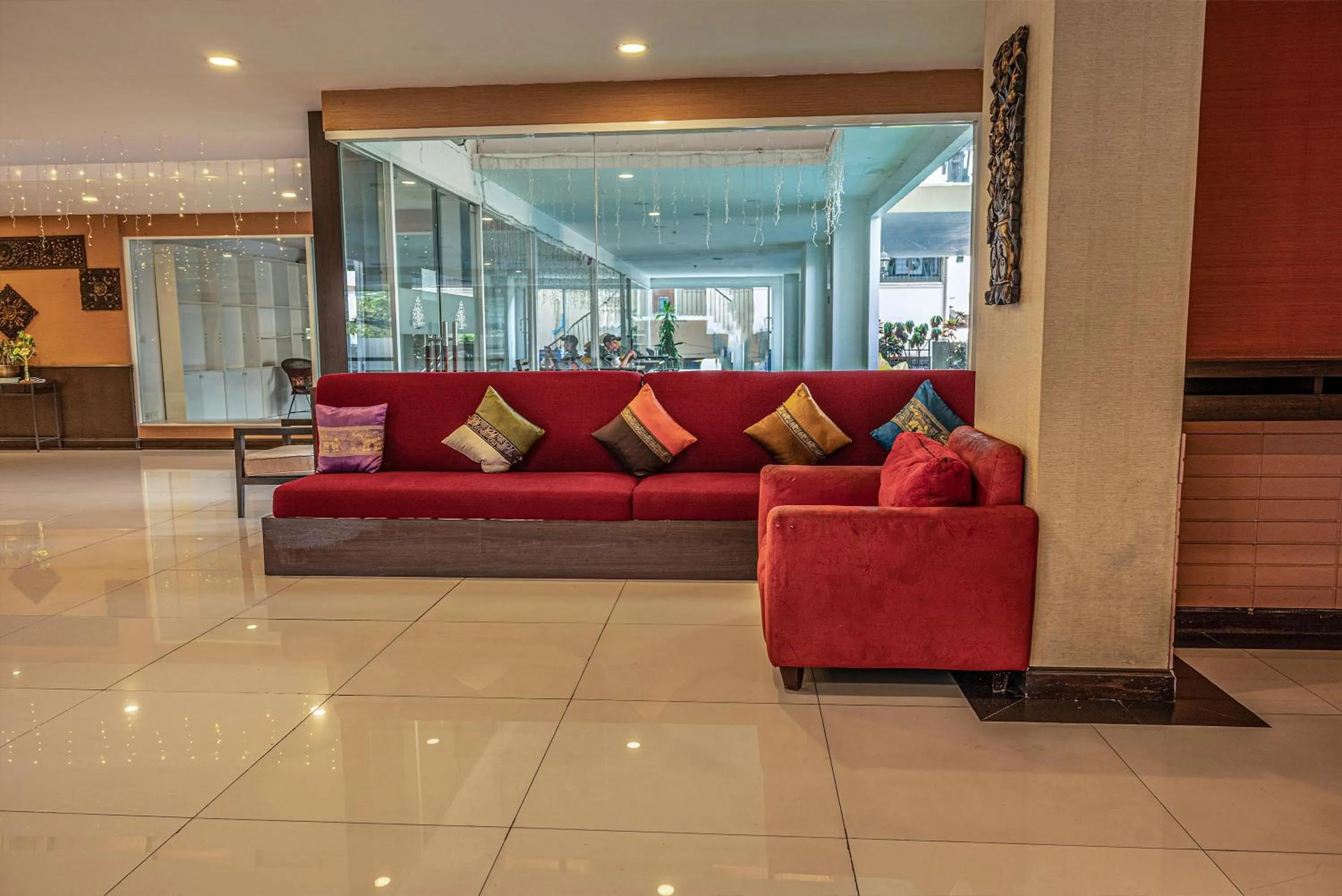 Seating area in Boss Suites Nana Hotel