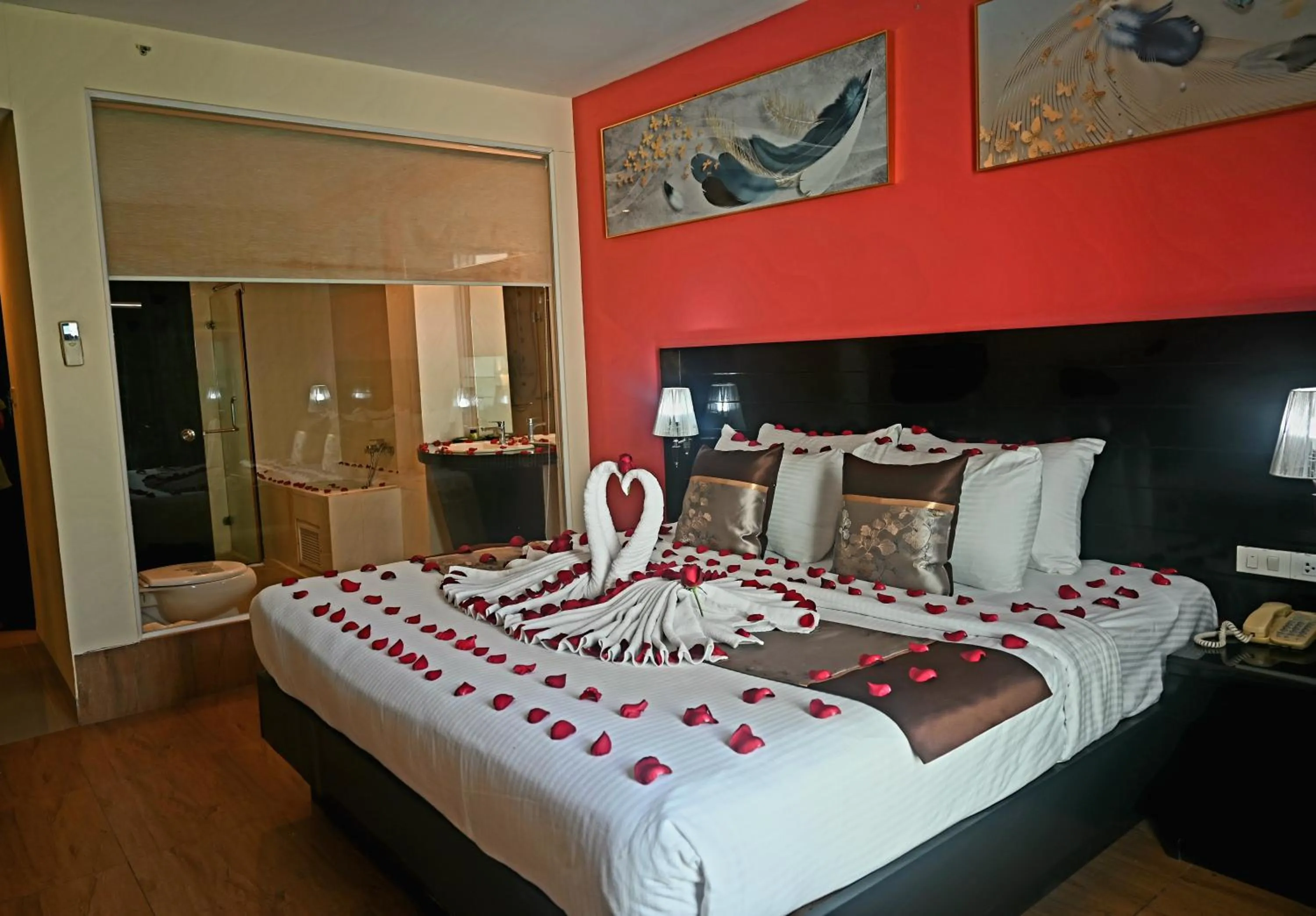 Bed in Boss Suites Nana Hotel