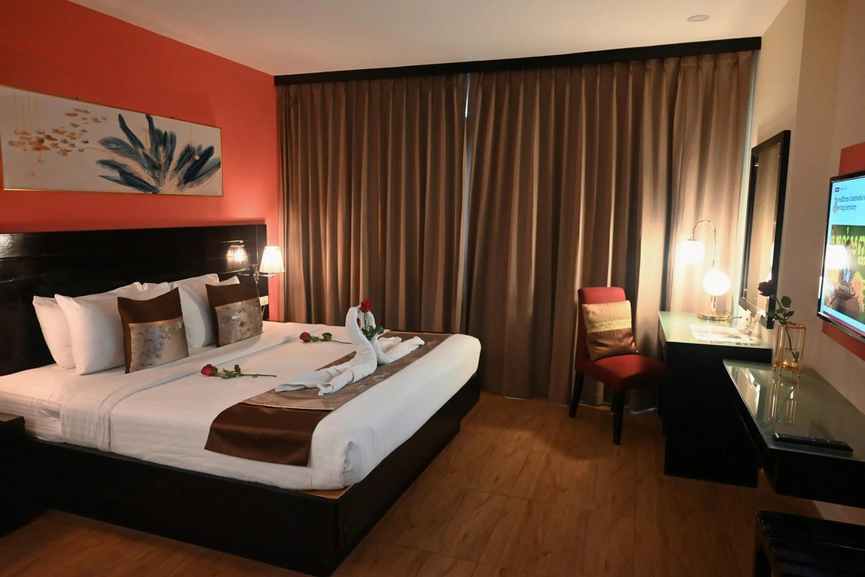 Bed in Boss Suites Nana Hotel