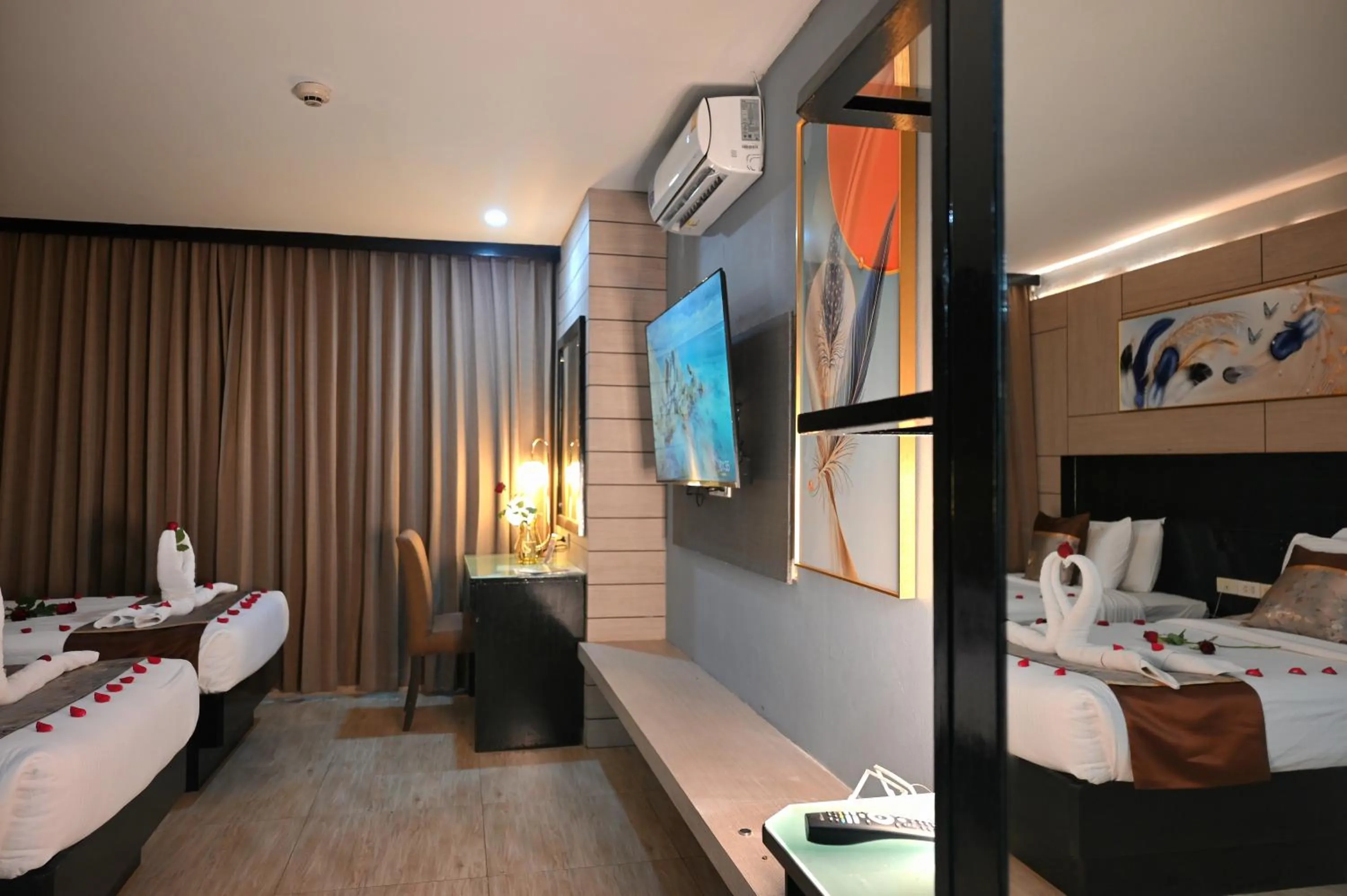 Bed in Boss Suites Nana Hotel