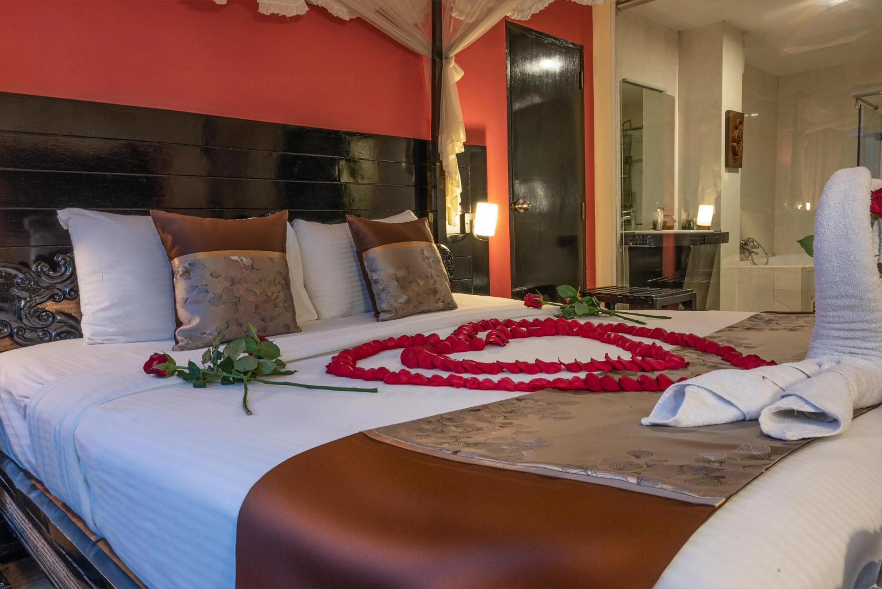 Bed in Boss Suites Nana Hotel